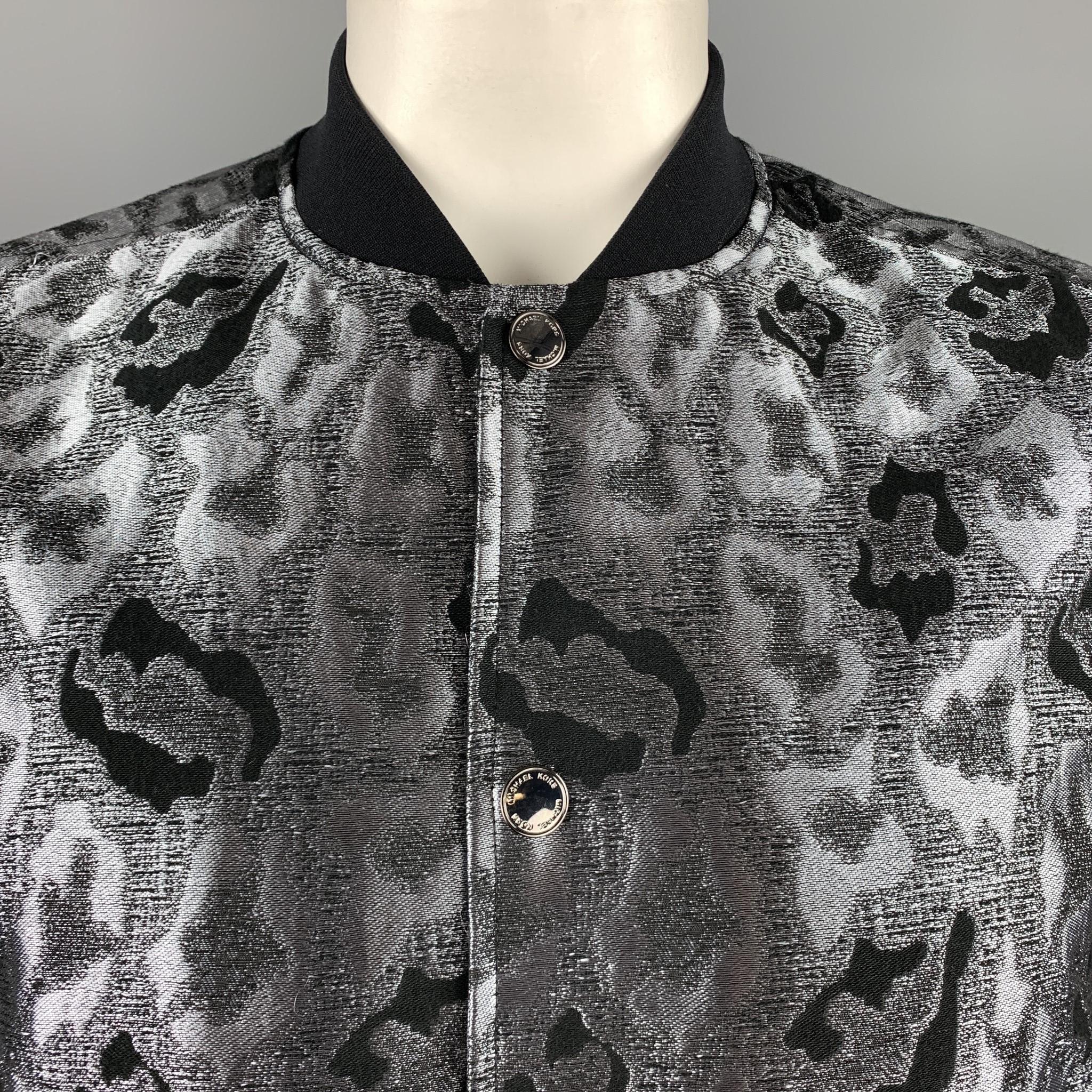 MICHAEL KORS jacket comes in silver and black silk blend leopard print jacquard with a baseball collar and snap closures. 

Excellent Pre-Owned Condition.
Marked: M

Measurements:

Shoulder: 17 in.
Chest: 44 in.
Sleeve: 26.5 in.
Length: 26.5 in.