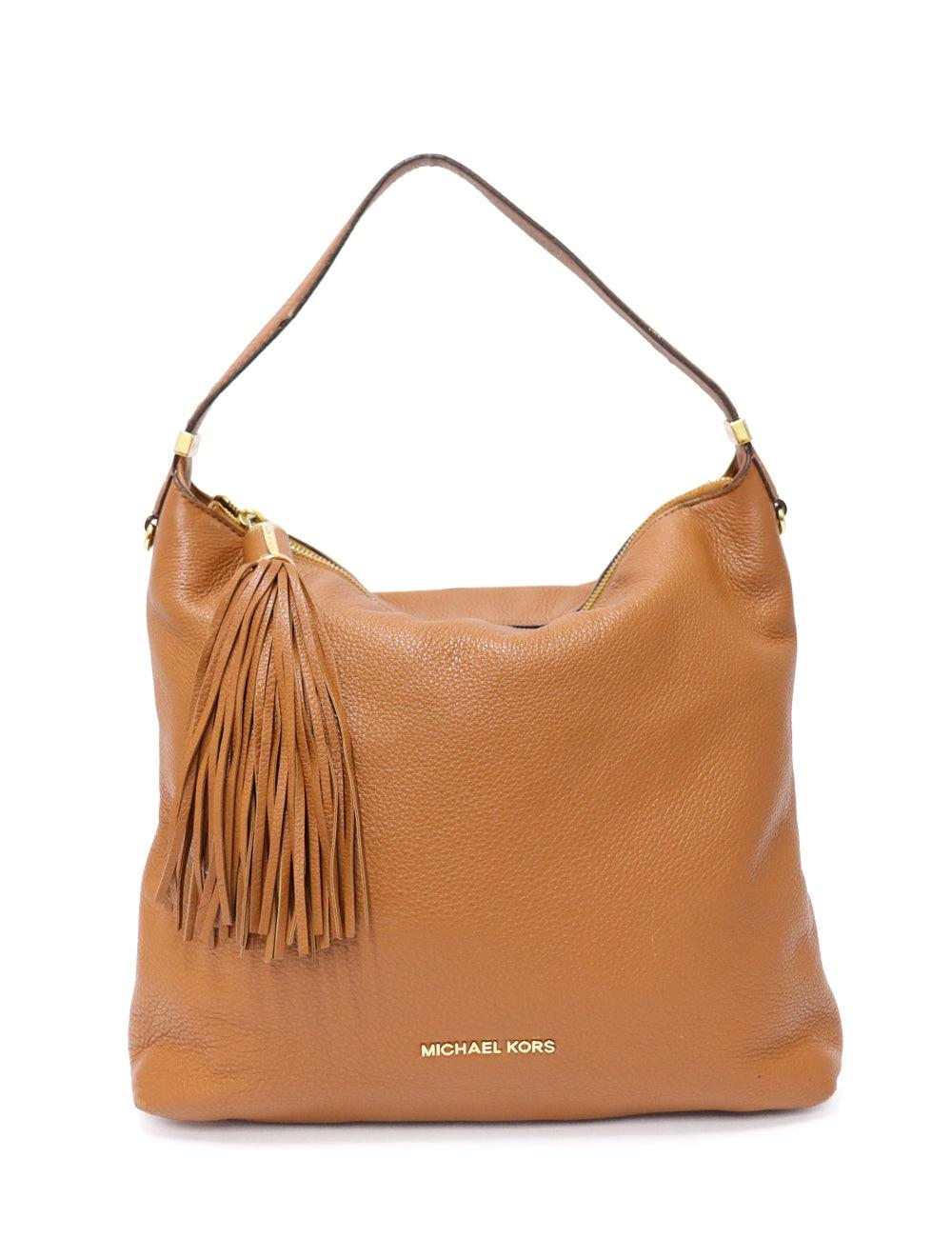 Michael Kors Tan shoulder bag with a fringe details in an great condition.

Additional information:
Material: Leather
Hardware: Gold
Measurements: 33 W x 10 D x 27 H cm
Handle Drop: 20 cm
Overall condition: Good
Interior condition: Signs of