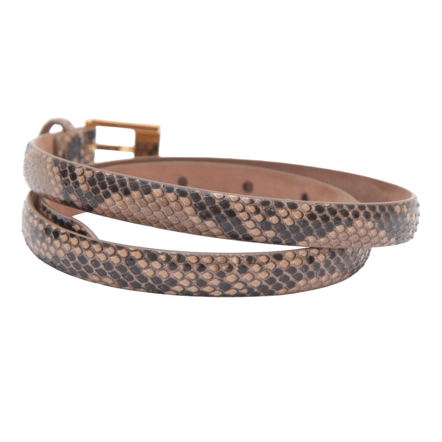 GUARANTEED AUTHENTIC MICHAEL KORS EXOTIC LEATHER SKINNY BELT

Retail excluding sales taxes $595

Details:
- From my personal collection.
- Exotic leather in brown cream colors.
- Thin skinny width.
- 4 holes.
- Gold-tone adjustable buckle.
-