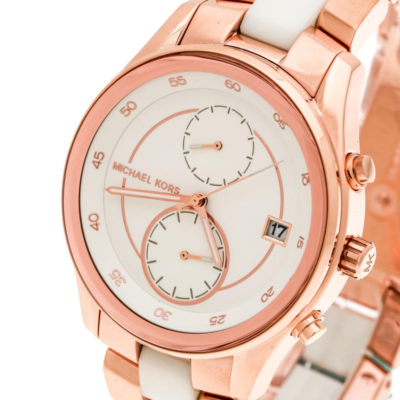 Leave your wrist to stand out when you wear this MK6467 from Michael Kors. Swiss made, it is crafted from rose gold-plated steel and acetate. On the white dial, there are minute markers around the outer rim, a date window, and two subdials. The