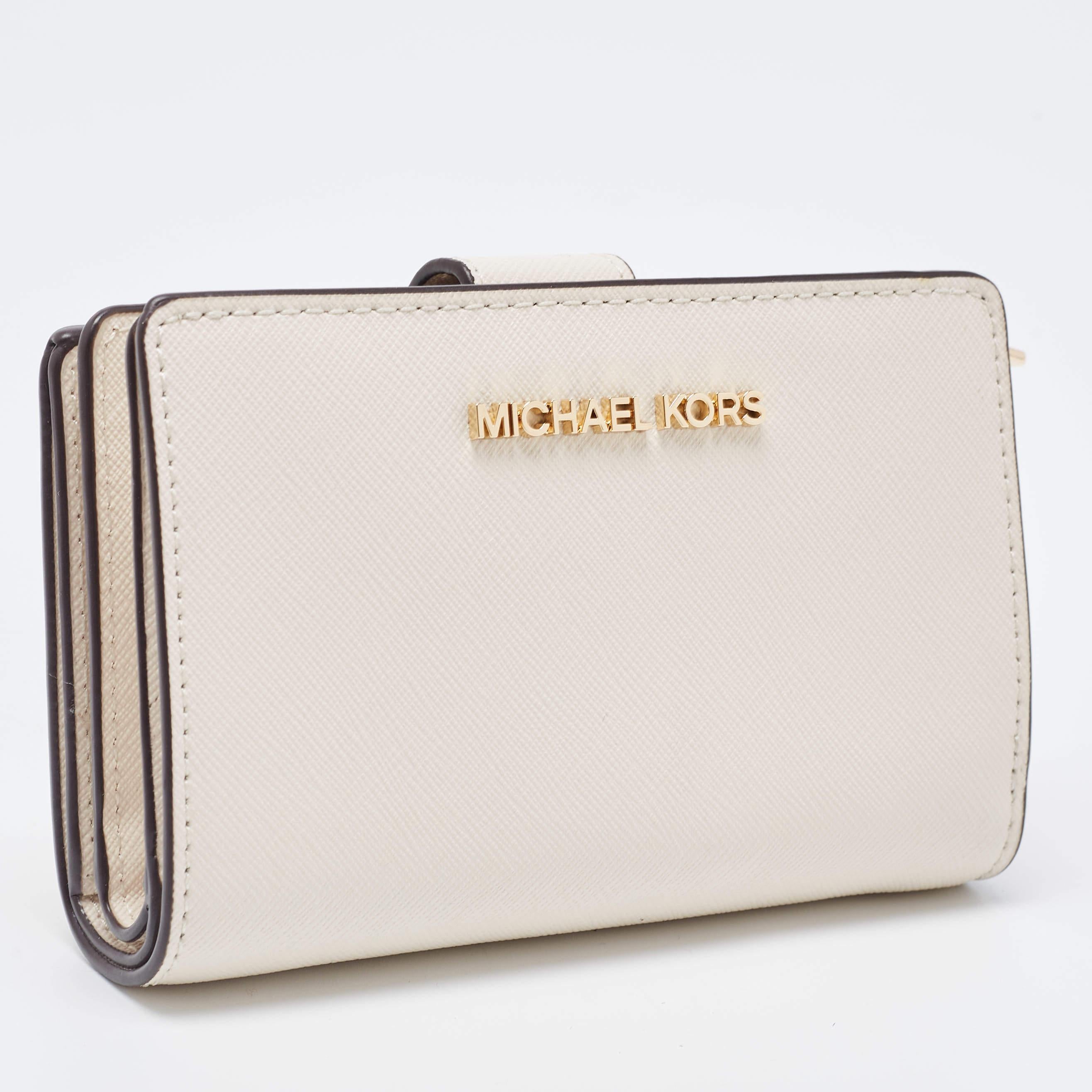 This MK wallet is an immaculate balance of sophistication and rational utility. It has been designed using prime quality materials and elevated by a sleek finish. The creation is equipped with ample space for your monetary essentials.

