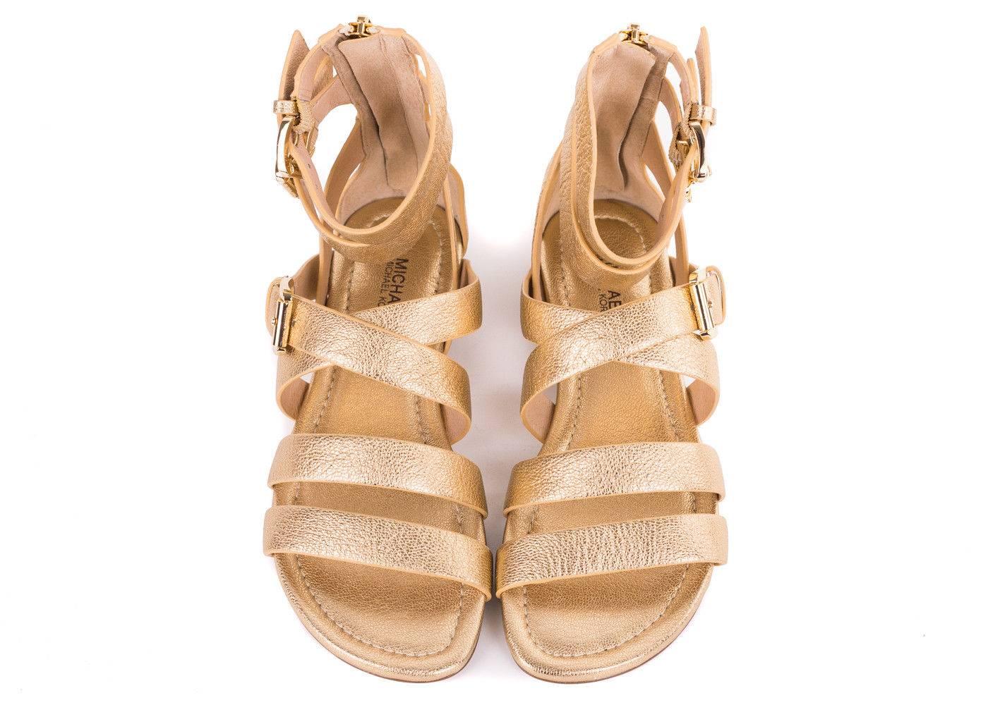 Micheal Kors Gold Sandal will be the final compliment to your ensemble. This shoe features gold tanned grained leather, gladiator style wraps, and double ankle buckle straps. Pair these shoes with a nude colored dress and you are set for the