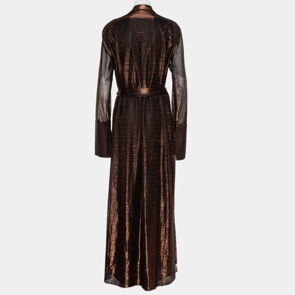 Turn heads when you wear this Michael Lo Sordo dress that lends a sophisticated edge to your personality. It is crafted from metallic lurex fabric and is styled with a collared neckline. The maxi dress has a slide slit, belt detailing, long sleeves
