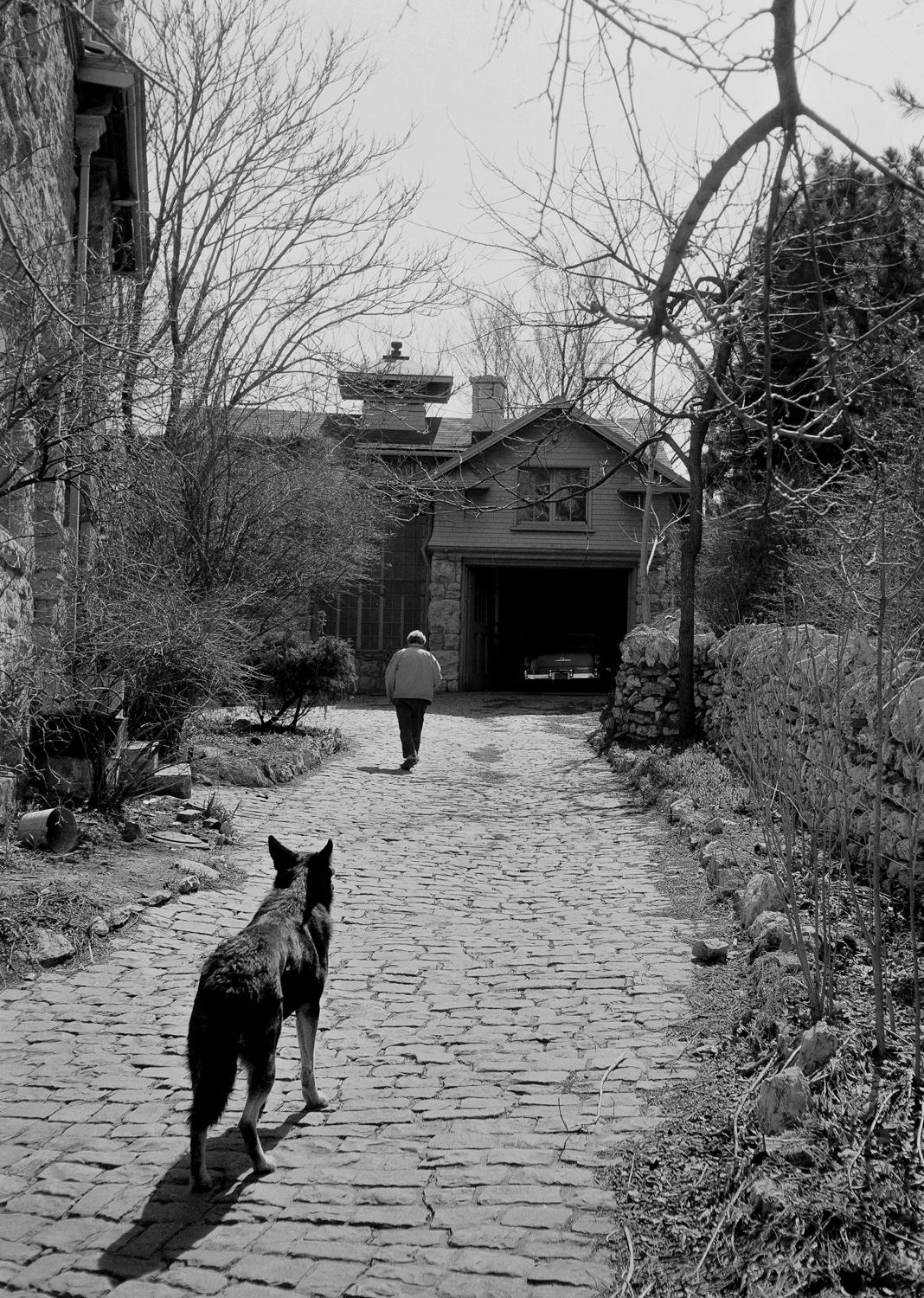Benton walking dog (Thomas Hart Benton Plate #6) - Photograph by Michael Mardikes
