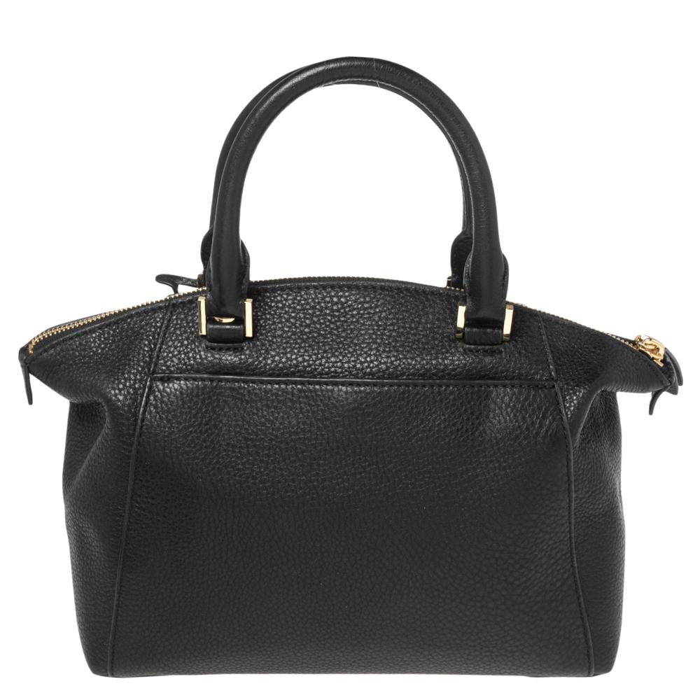 Make this MICHAEL Michael Kors satchel a part of your amazing bag collection. Created using black leather, it comes with two top handles and a shoulder strap for effortless use. Gold-tone hardware and a roomy fabric interior provide the finishing