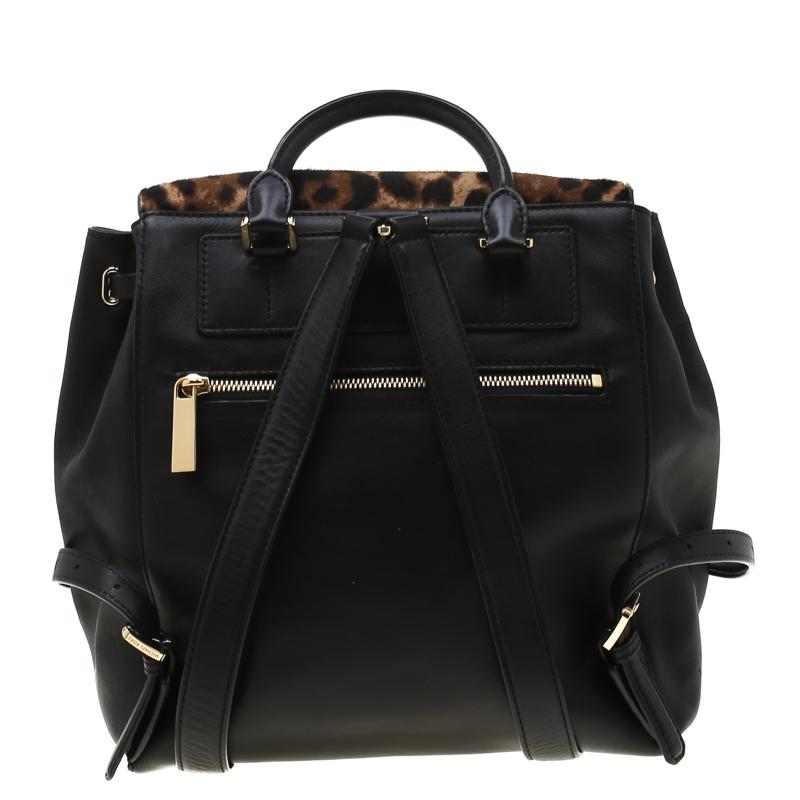 To accompany all your casual outings in the most fashionable way, MICHAEL Michael Kors brings you this backpack that boasts of fabulous style. The leather bag has a leopard-printed calfhair flap to secure the nylon interior and is held by a top
