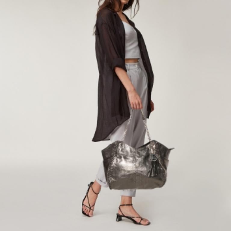 Comfortable to carry without compromising on style, this MICHAEL Michael Kors satchel is crafted from python-effect leather. It features dual top handles, chain detailing, and a nylon-lined interior with enough space for your necessities.