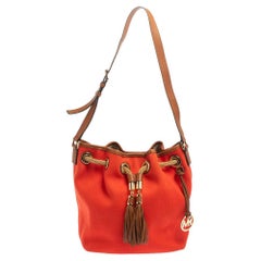 Michael Kors - Sac seau Marina en toile et cuir rouge avec cordon de serrage