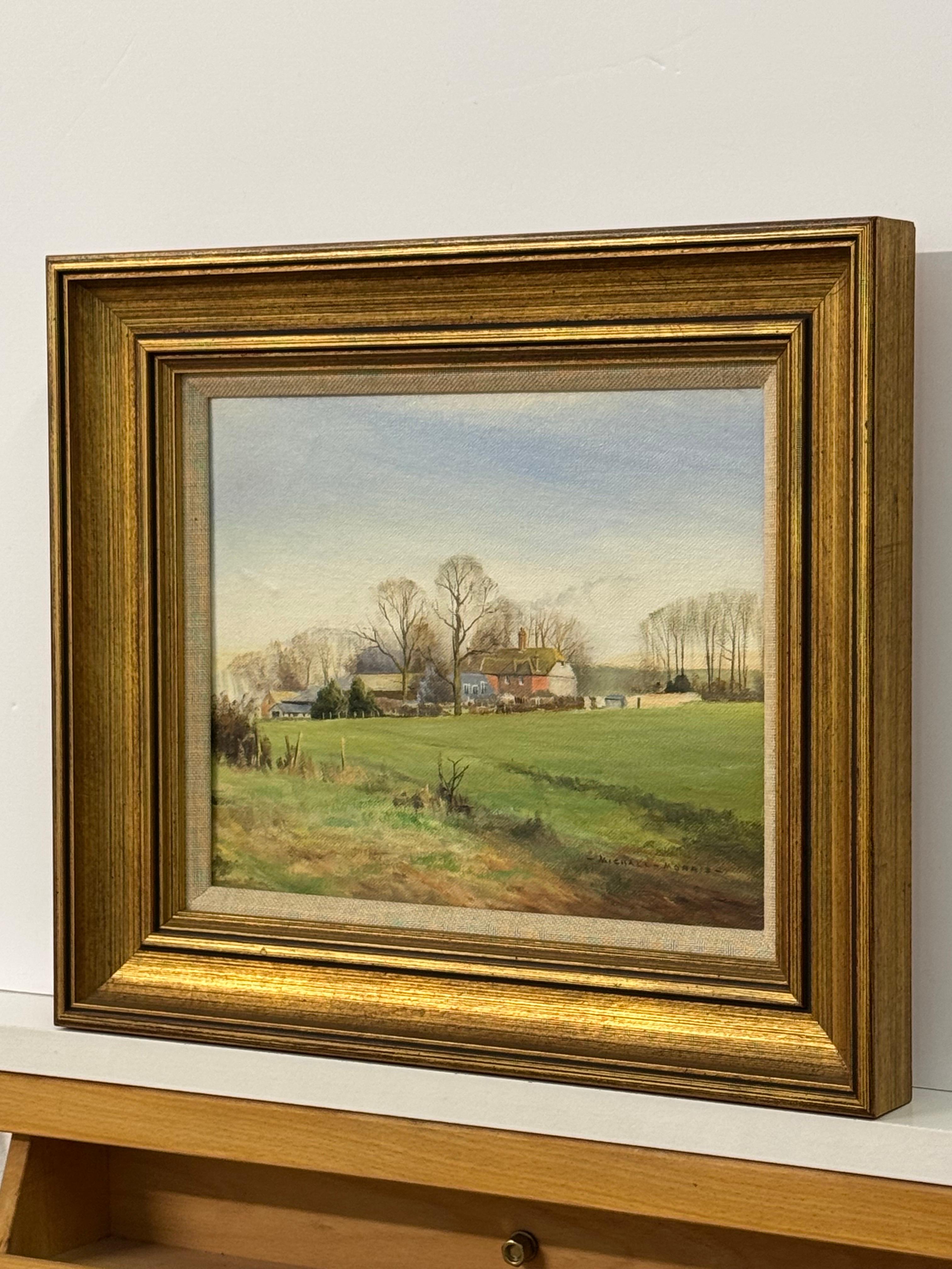 Paisaje rural, iglesia, casitas, carretera sinuosa, luz suave, encanto intemporal - Landscape Painting Marrón de Michael Morris