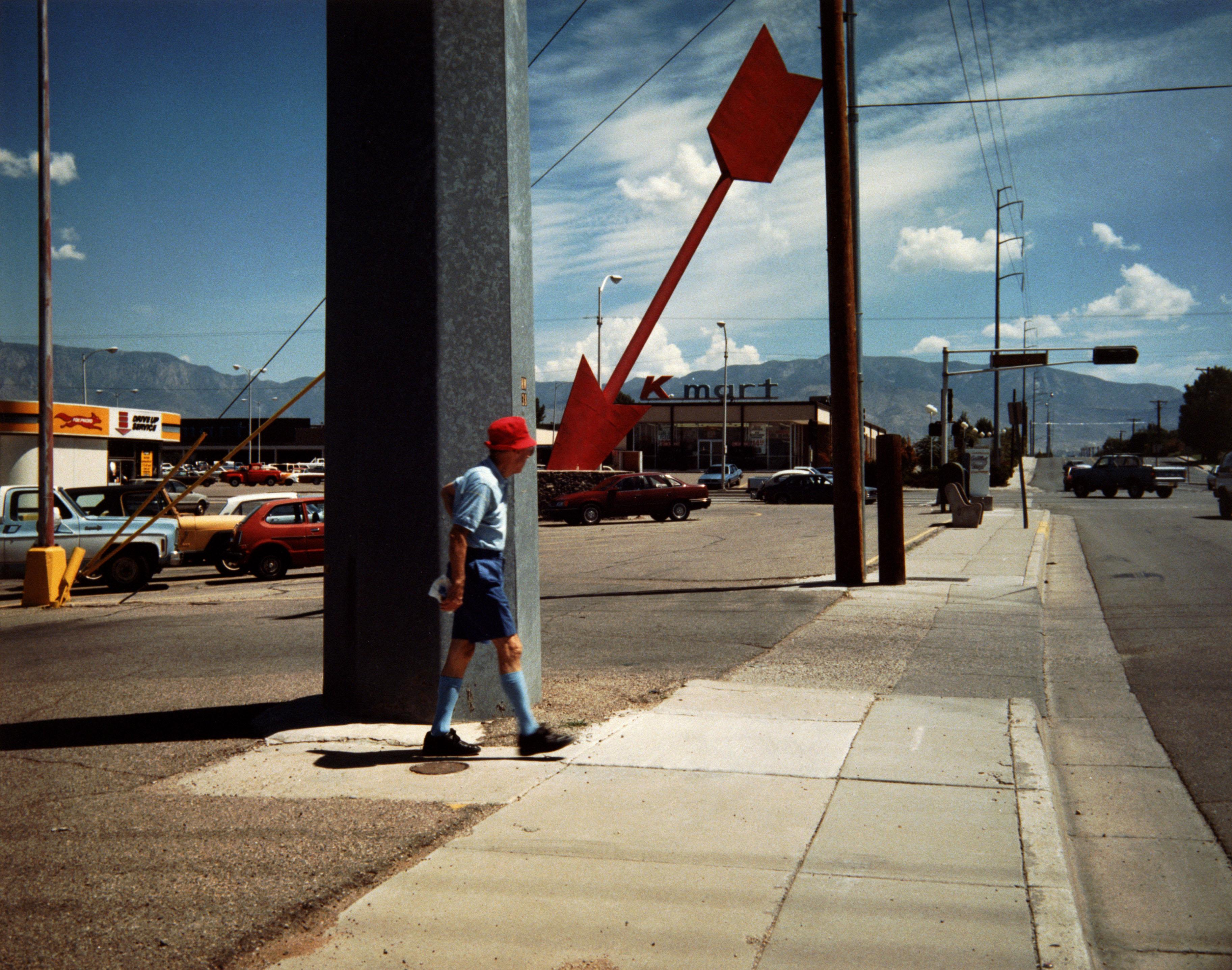Man and Red Arrow - Color Print on Hahnemuhle Paper