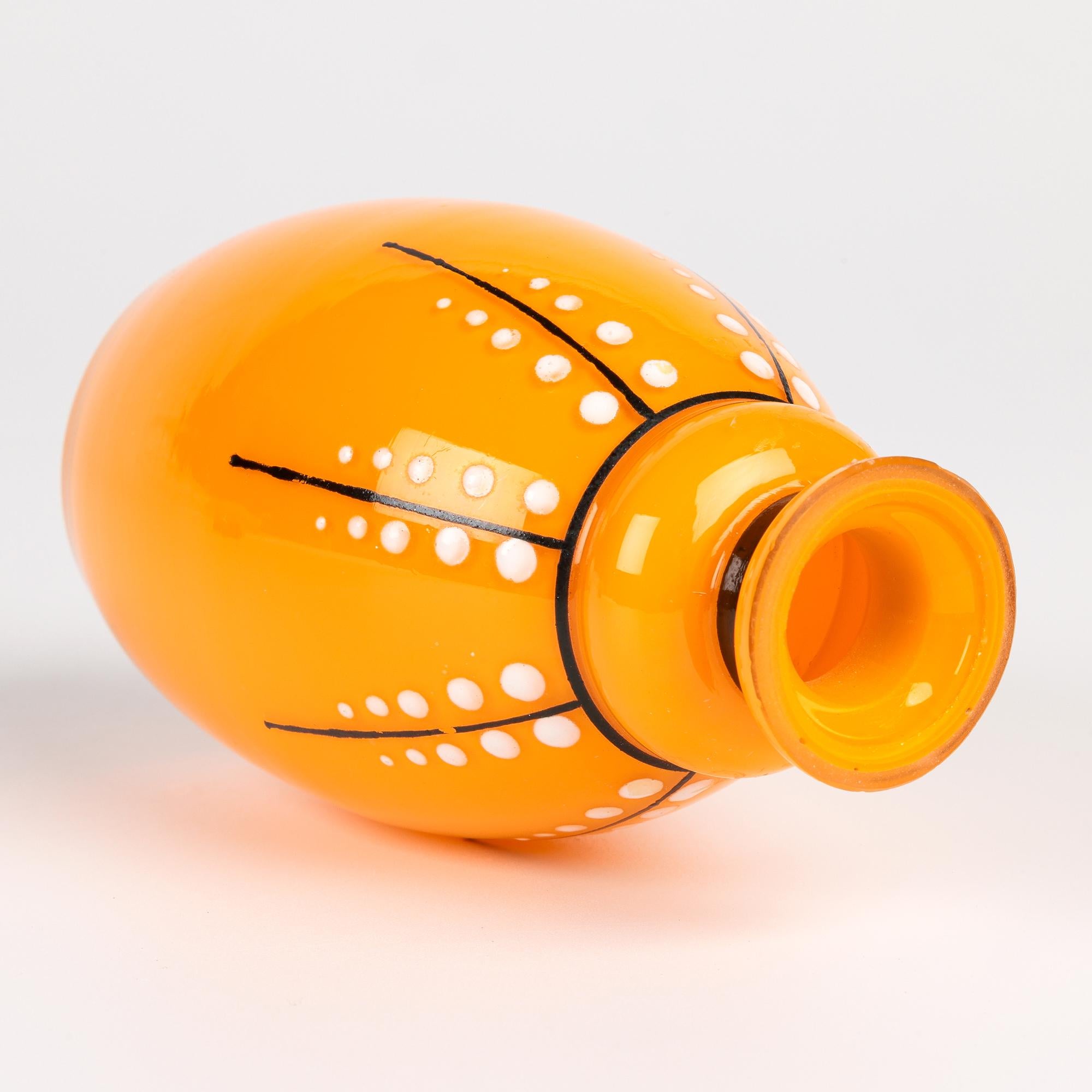 A striking Tango art glass scent bottle, possibly by Loetz applied with trailing designs attributed to renowned Austrian Sculptor, Ceramist and Designer Michael Powolny (Austrian, 1871-1954) and dating from around 1920. 

Michael Powolny produced a