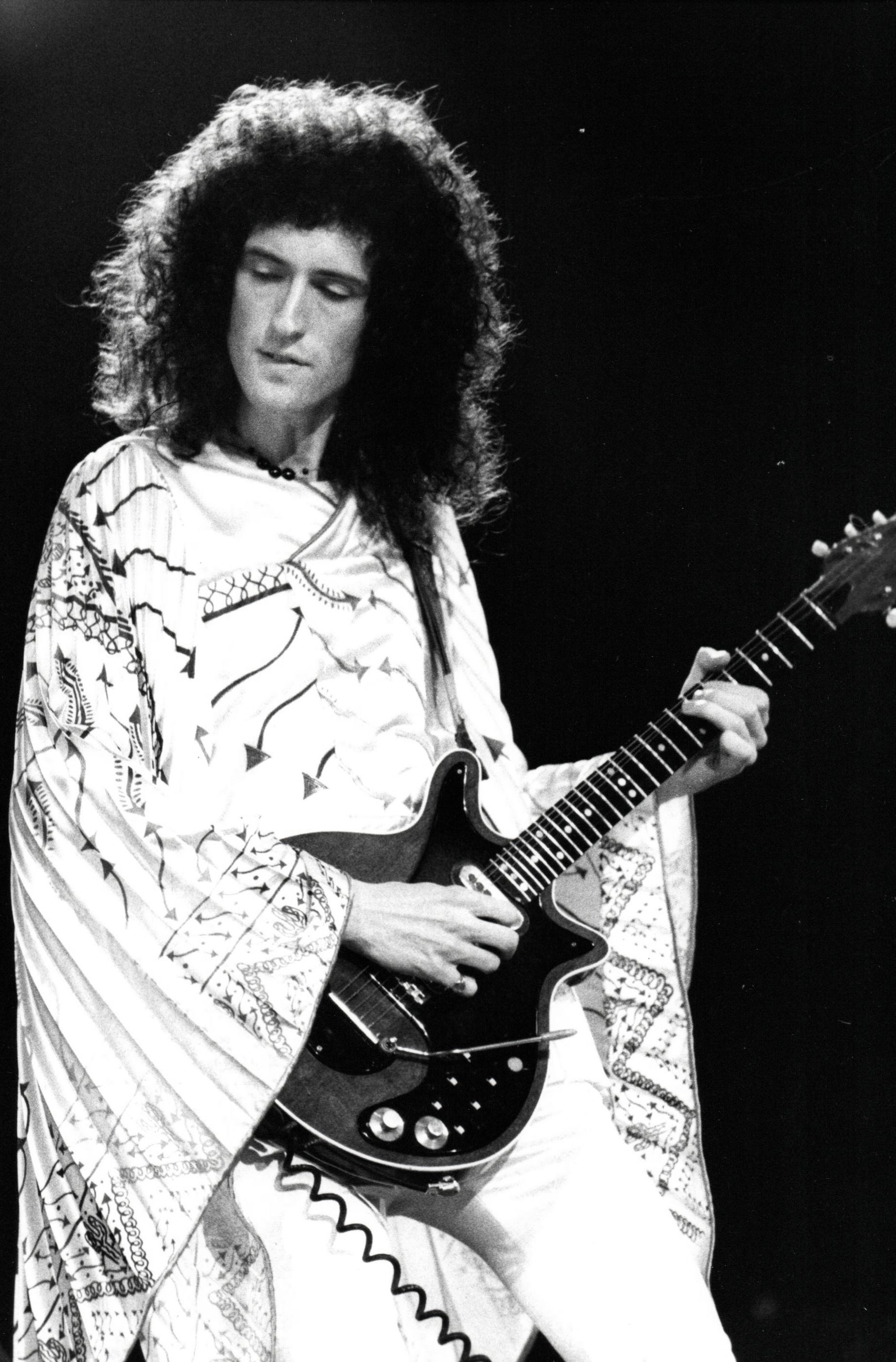 Michael Putland Portrait Photograph - Brian May of Queen Playing Guitar on Stage Vintage Original Photograph