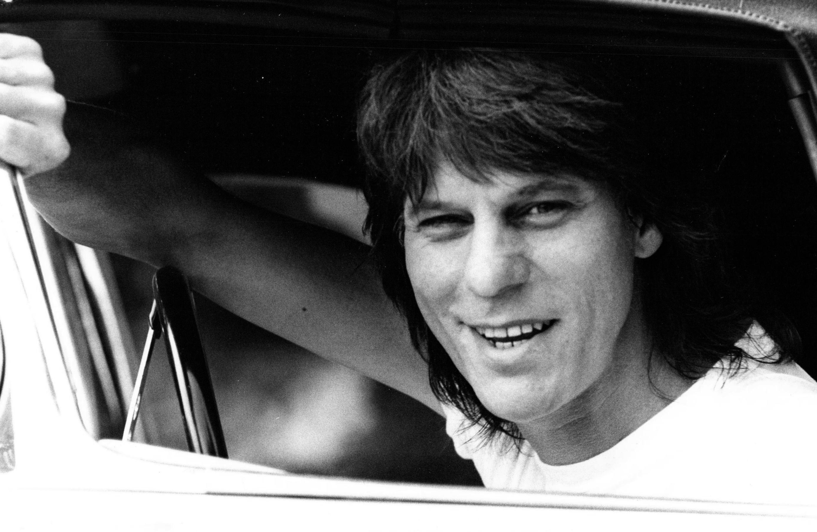 Michael Putland Portrait Photograph - Jeff Beck Smiling in Car Window Vintage Original Photograph