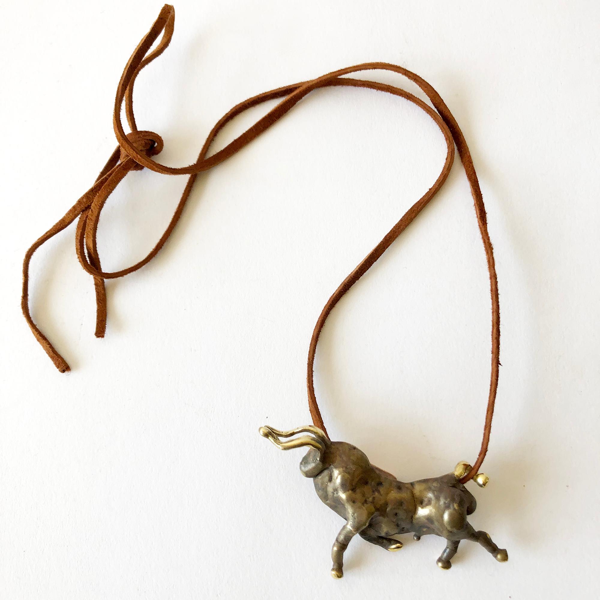 One of a kind, torch welded bronze bull pendant created by sculptor and jeweler Michael Schwade of West Fork, Arkansas.  In 1975, Schwade was a student of Ernesto Gonzalez, the master sculptor from Havana, and was taught his method of applying