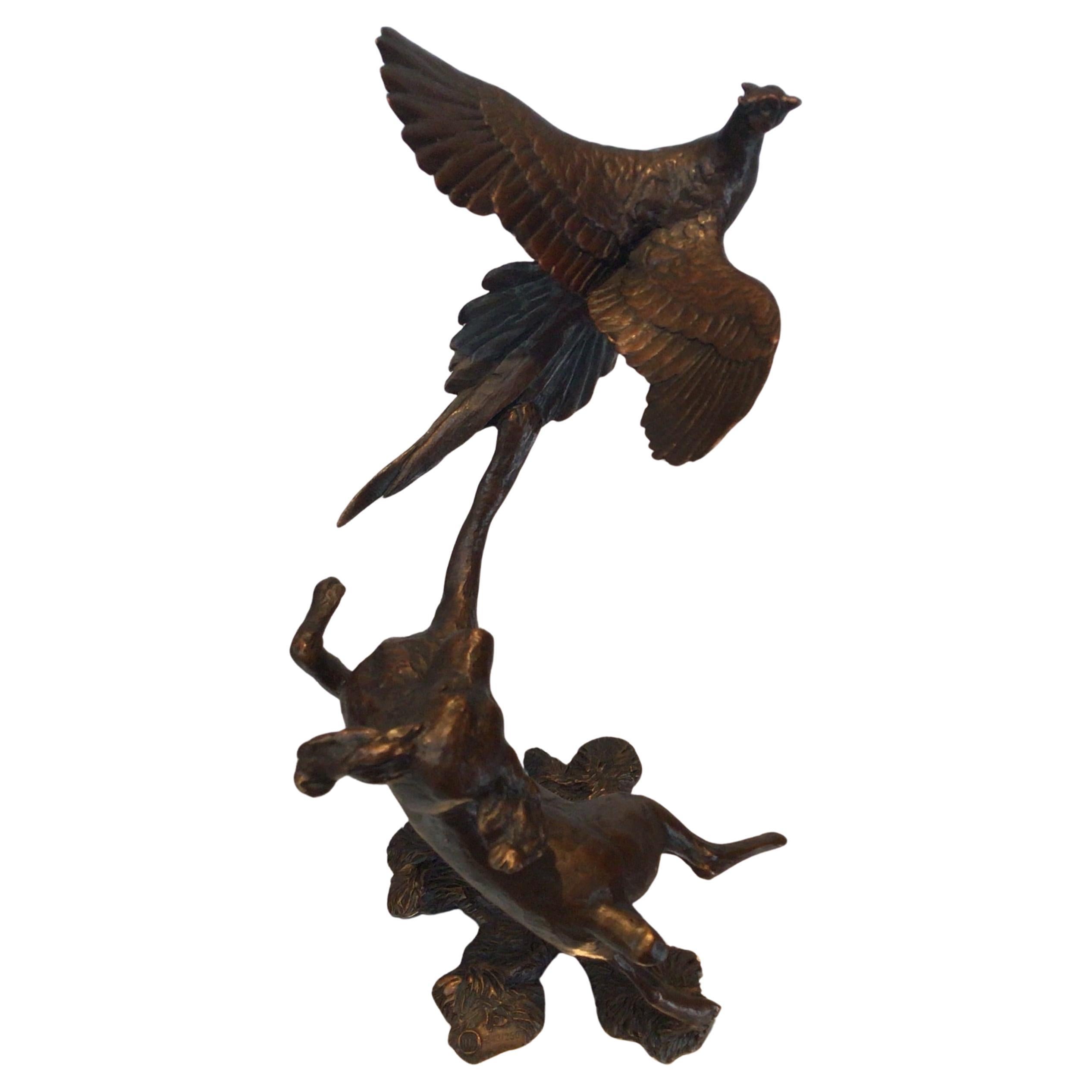 This signed bronze sculpture is a stunning example of one of Michael Simpsons bronzes, depicting a Springer Spaniel chasing after a pheasant in flight. The exquisite attention to detail in this piece, captures the essence of this beloved dog breed,
