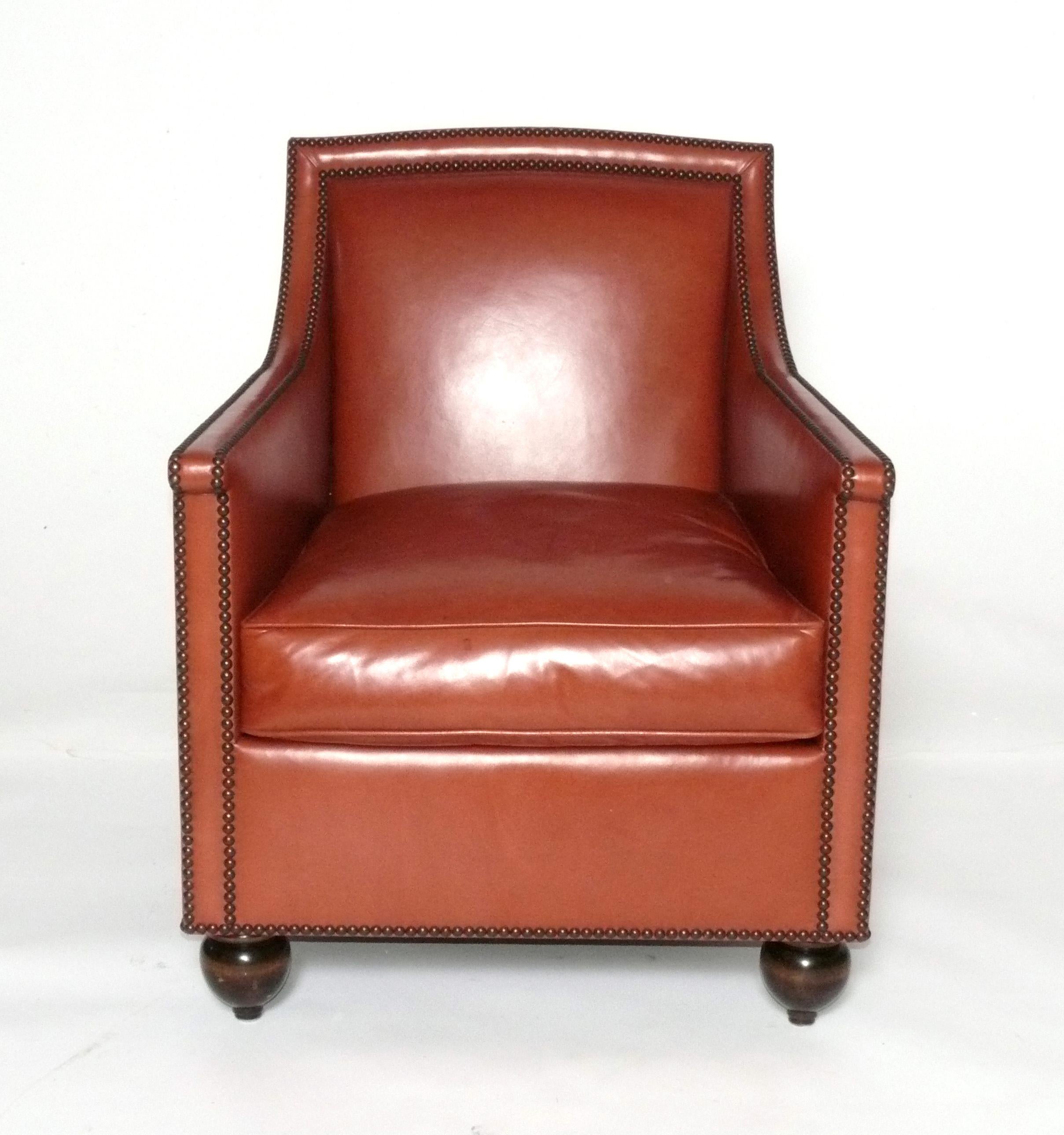 Elegant Cognac Leather Lounge Chair, designed by Michael S. Smith, American, circa 2000s. It features antiqued brass nailheads. 