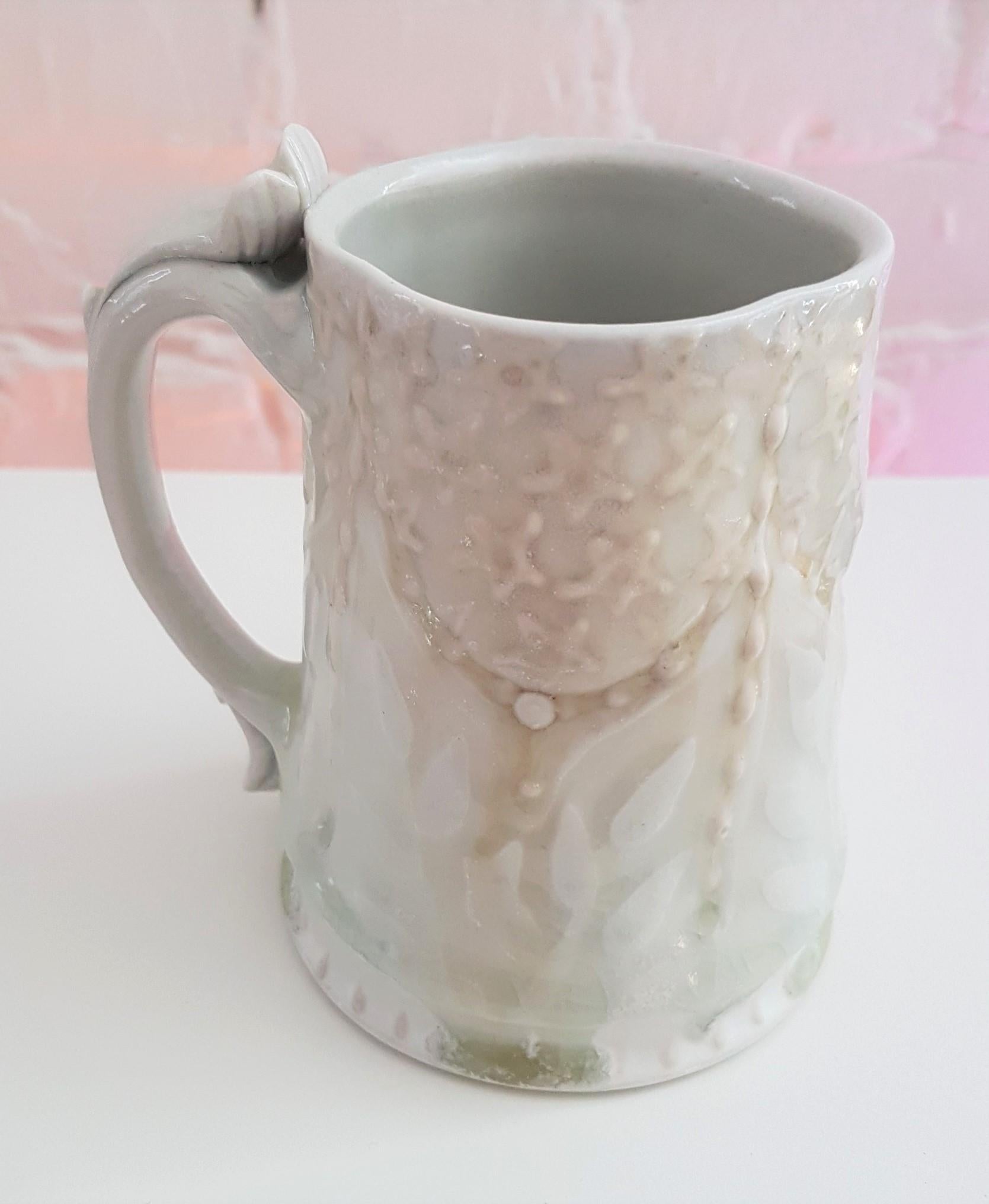 Michael Stumbras
Lost Age Mug
Year: 2017
Materials: Porcelain, Gold Luster
Size: 4.75 x 4.75 inches

Michael Stumbras work explores the beauty and horror of our existential uncertainties as creatures seeking meaning in a microcosm. These pots