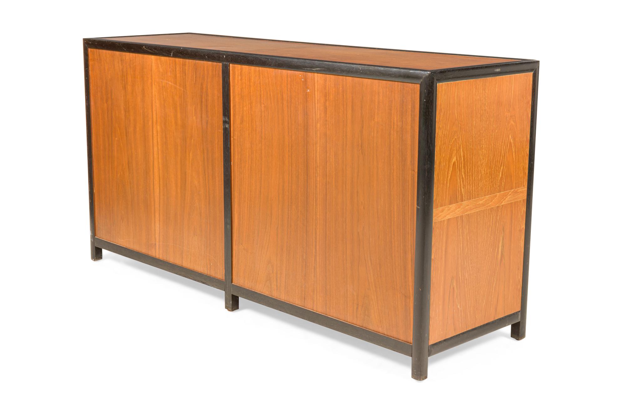 20th Century Michael Taylor 8-Drawer Walnut and Interlocking Brass Ring Pull Low Chest For Sale
