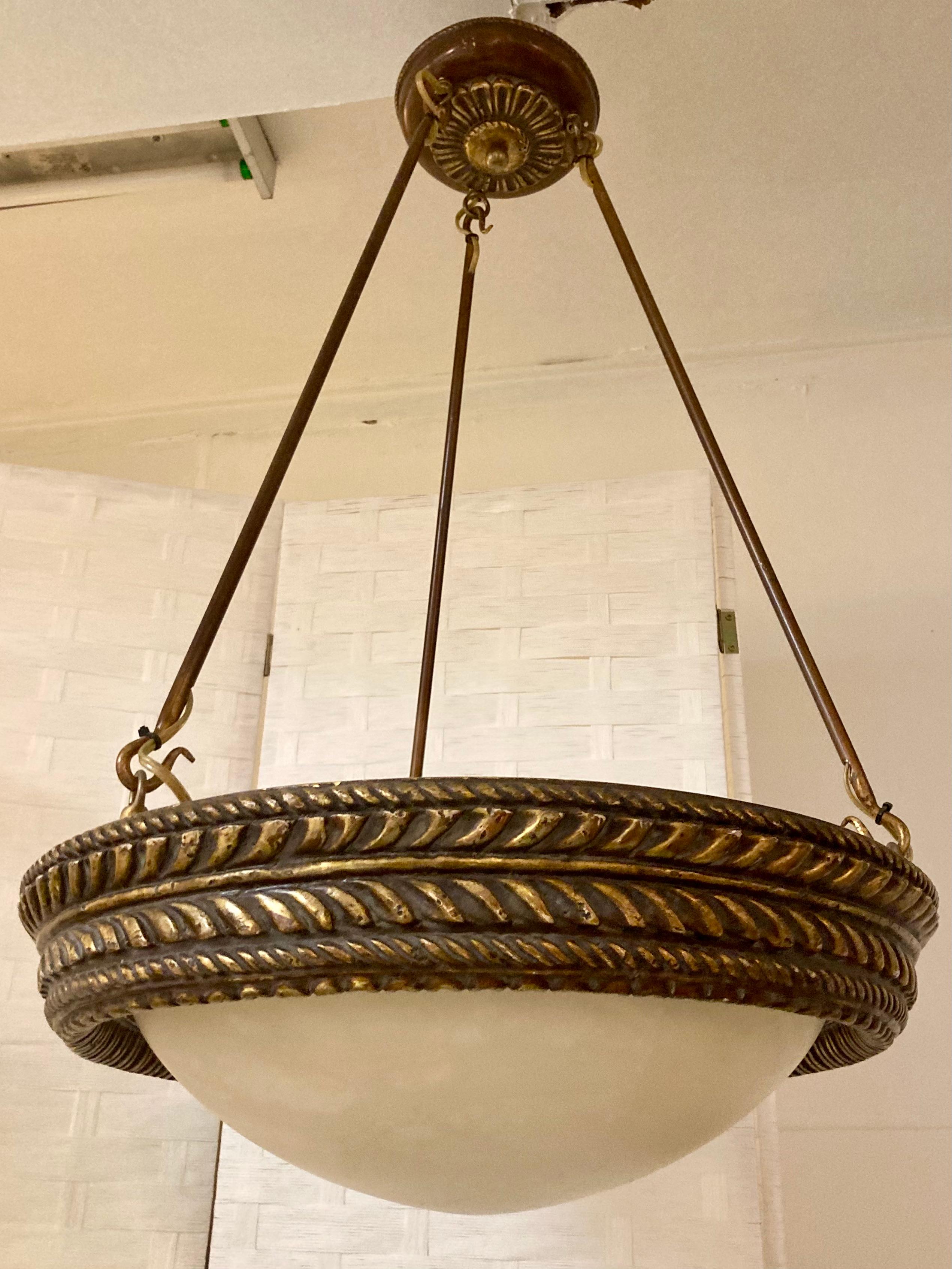 Michael Taylor alabaster pendant fixture with 3 stationary rods. Beautiful carved details on fixture and also in the canopy. Have your electrician install this fixture. Some scratches on alabaster, but adds to the character. We have a second one