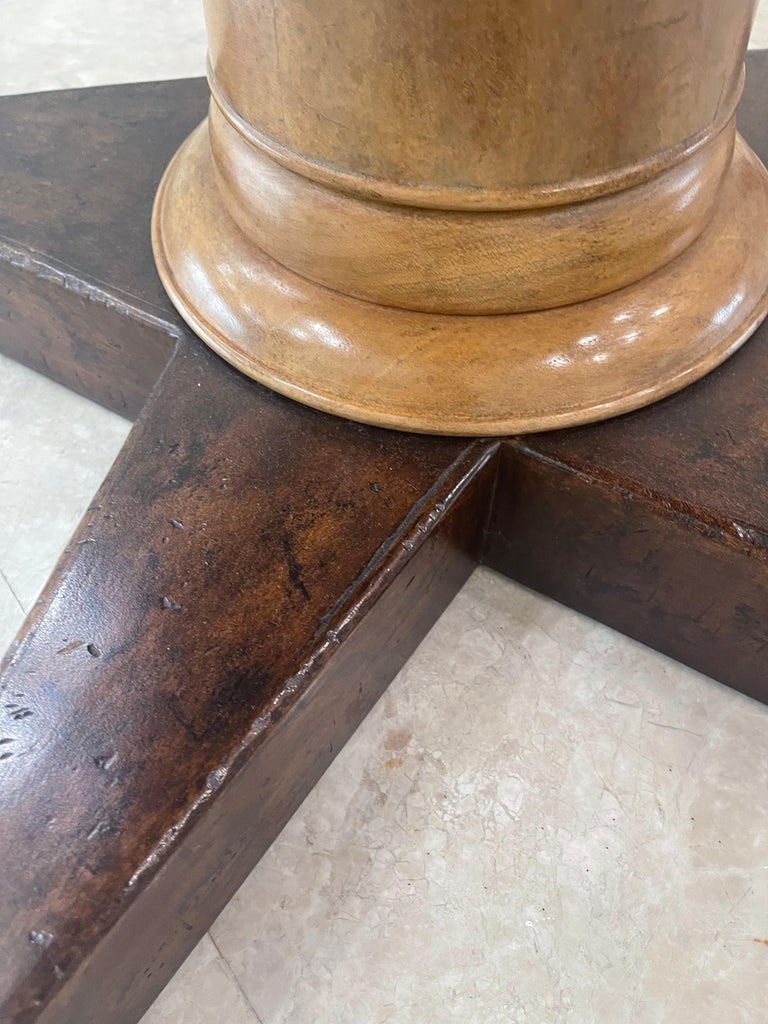 This small table can be used in many places. It was previously in the Versace mansion on south beach. The base is very nice and I really like the light wood pedestal. Very elegant table.