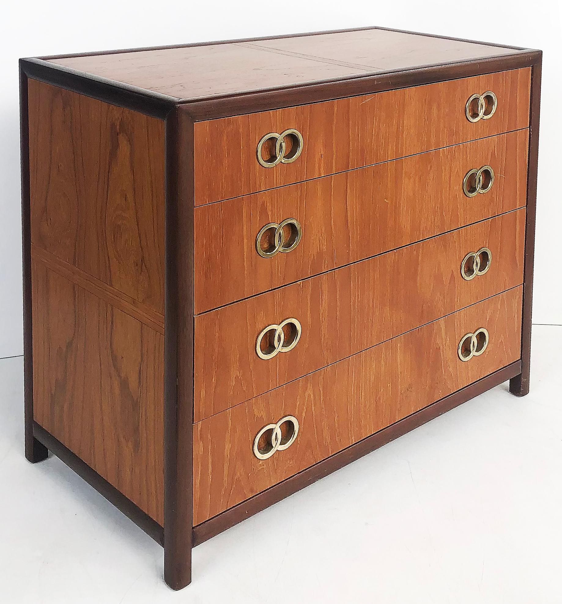 Michael Taylor baker 4 drawer chests with brass ring hardware, a pair

Offered for sale is a pair of Michael Taylor for Baker four-drawer chests with beautifully matched grained woods and brass intertwining ring pulls. The chests are finished on