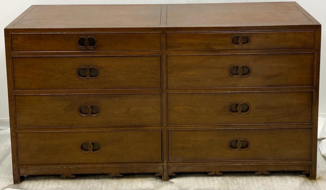 This is a Michael Taylor for Baker Furniture modern mahogany chest of drawers that is part of his 1970s Far East Collection. It is marked and in very good condition. There are two available.