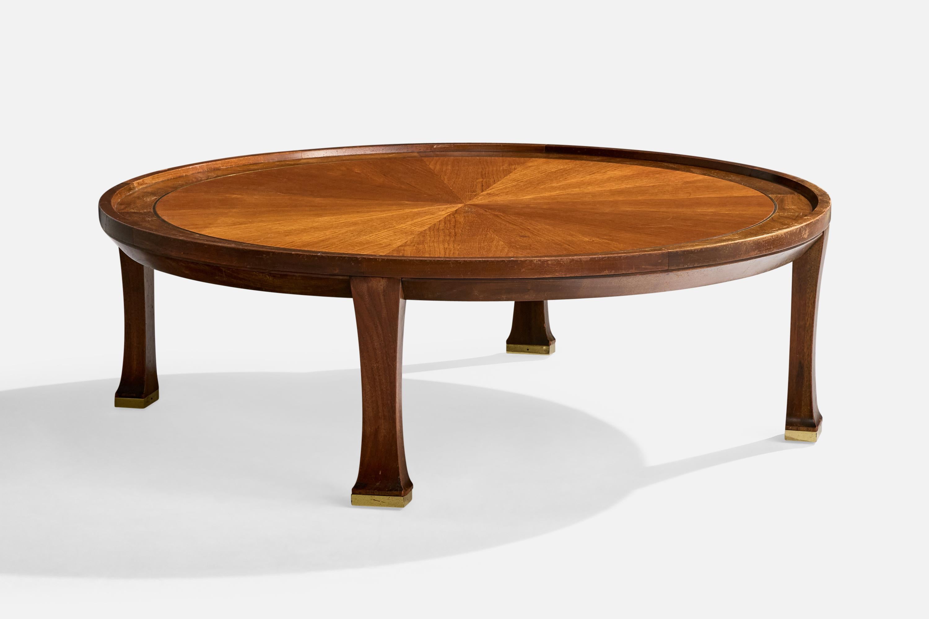 A walnut and brass coffee table designed by Michael Taylor and produced by Baker Furniture, USA, c. 1950s.

Oxidation present to brass

Wear consistent with age and use

Overall Dimensions (inches): 16.25