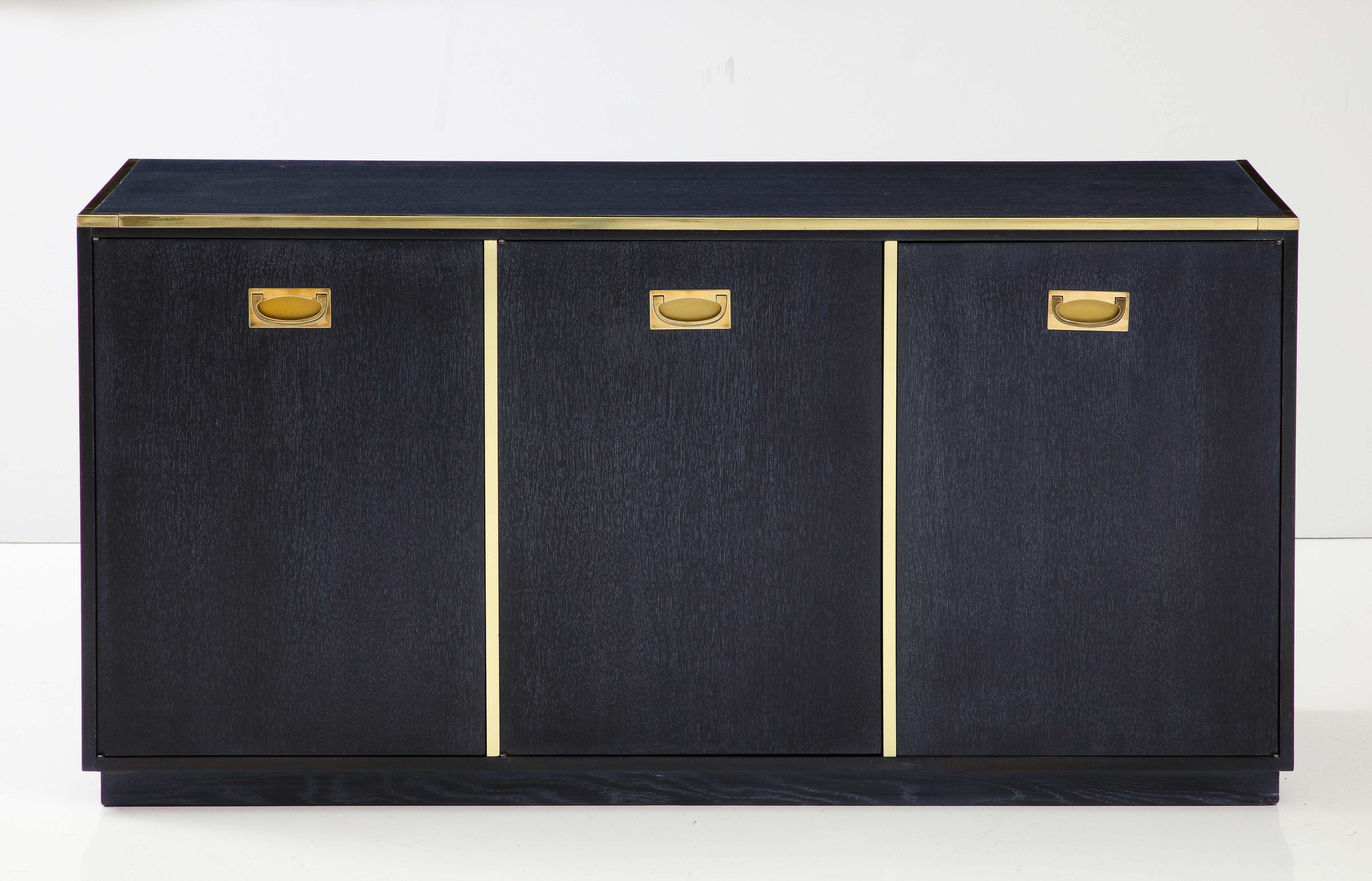 1960s Mid-Century Modern brass and oak small credenza designed by Michael Taylor for Baker. Newly restored in dark blue cerused finish.