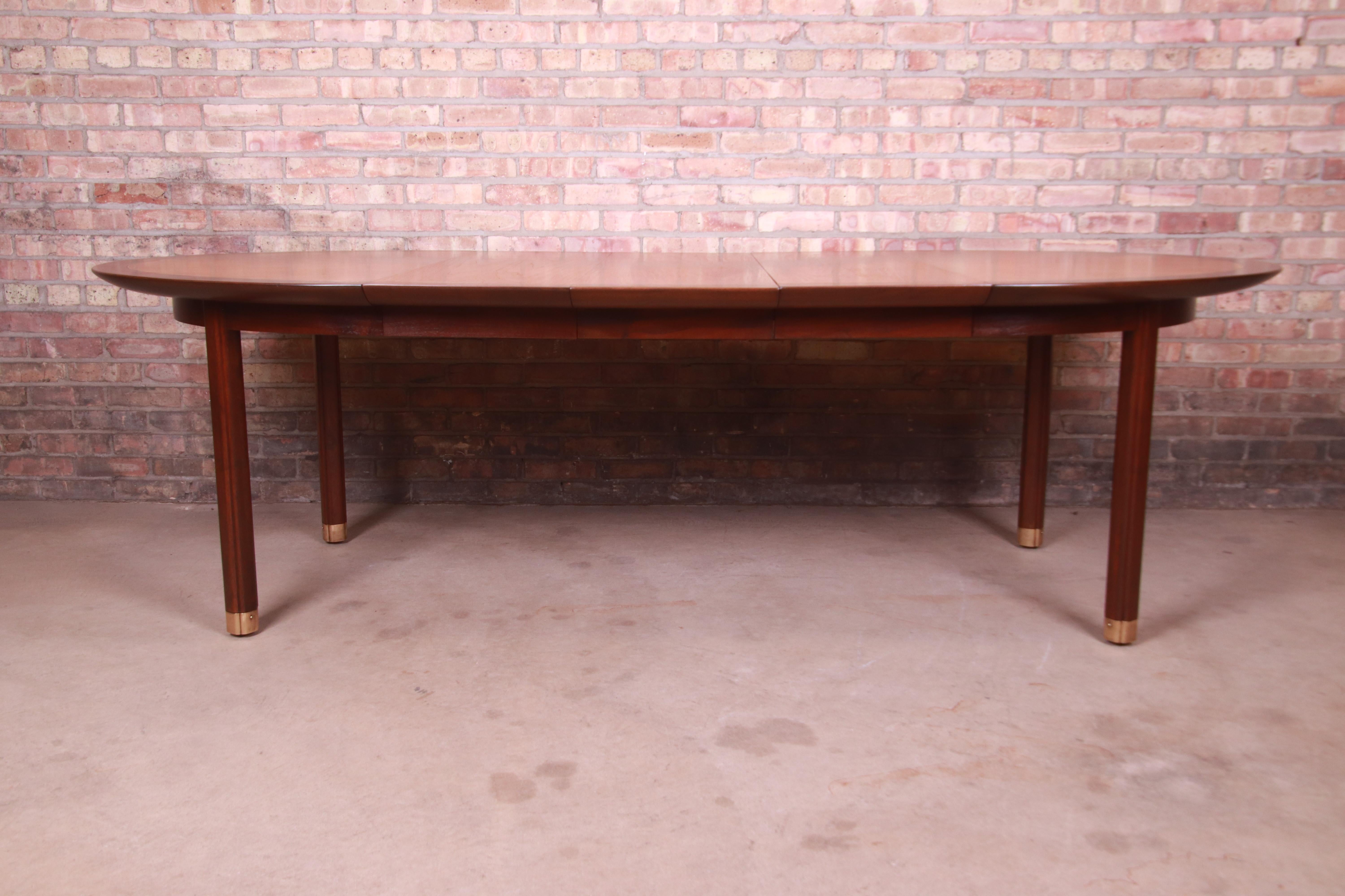 An exceptional mid-century modern Hollywood Regency extension dining table

By Michael Taylor for Baker Furniture, 