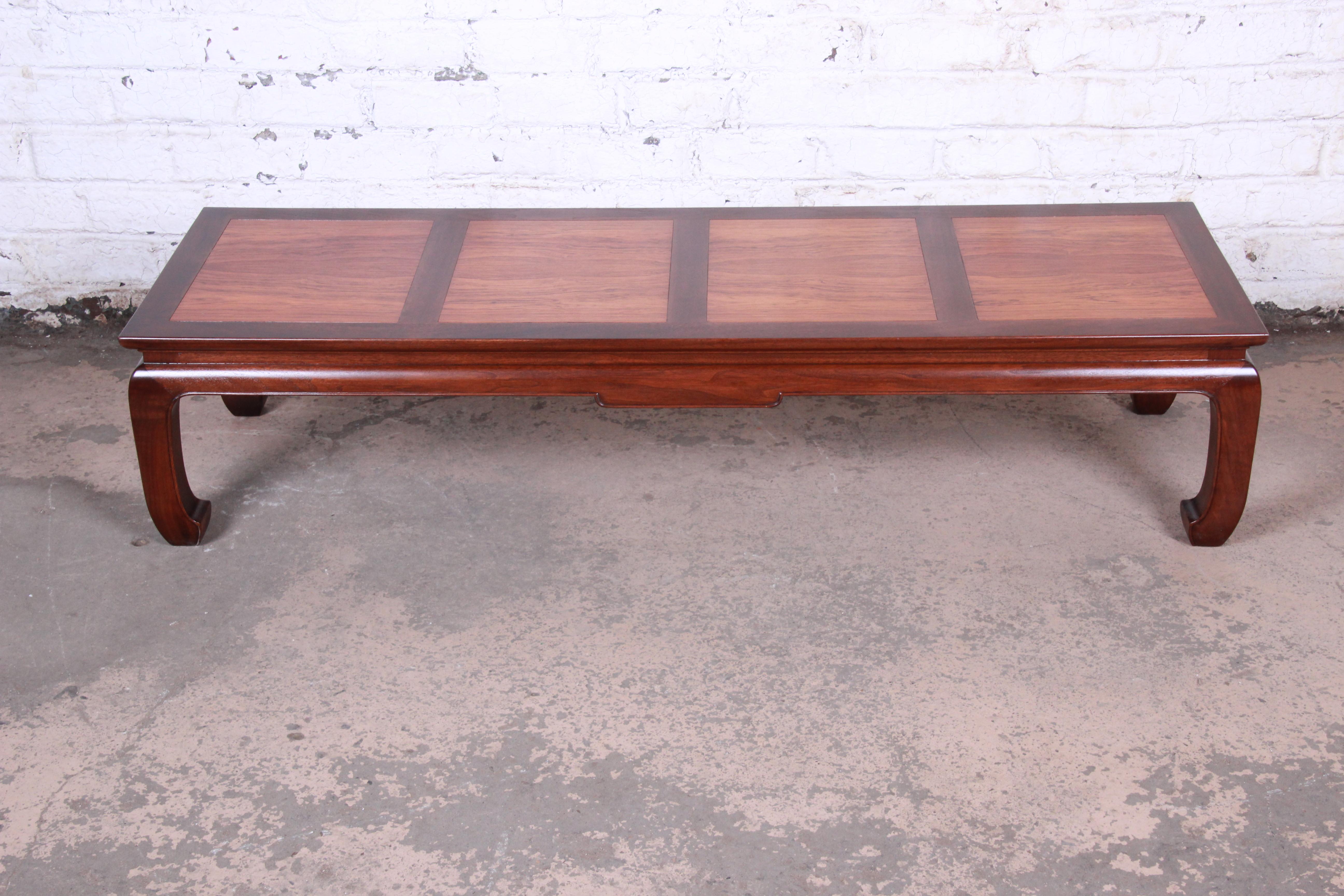 A gorgeous Mid-Century Modern Hollywood Regency chinoiserie coffee or cocktail table

Designed by Michael Taylor for the Far East Collection for Baker Furniture

USA, 1960s

Bookmatched rosewood and walnut

Measures: 63.25