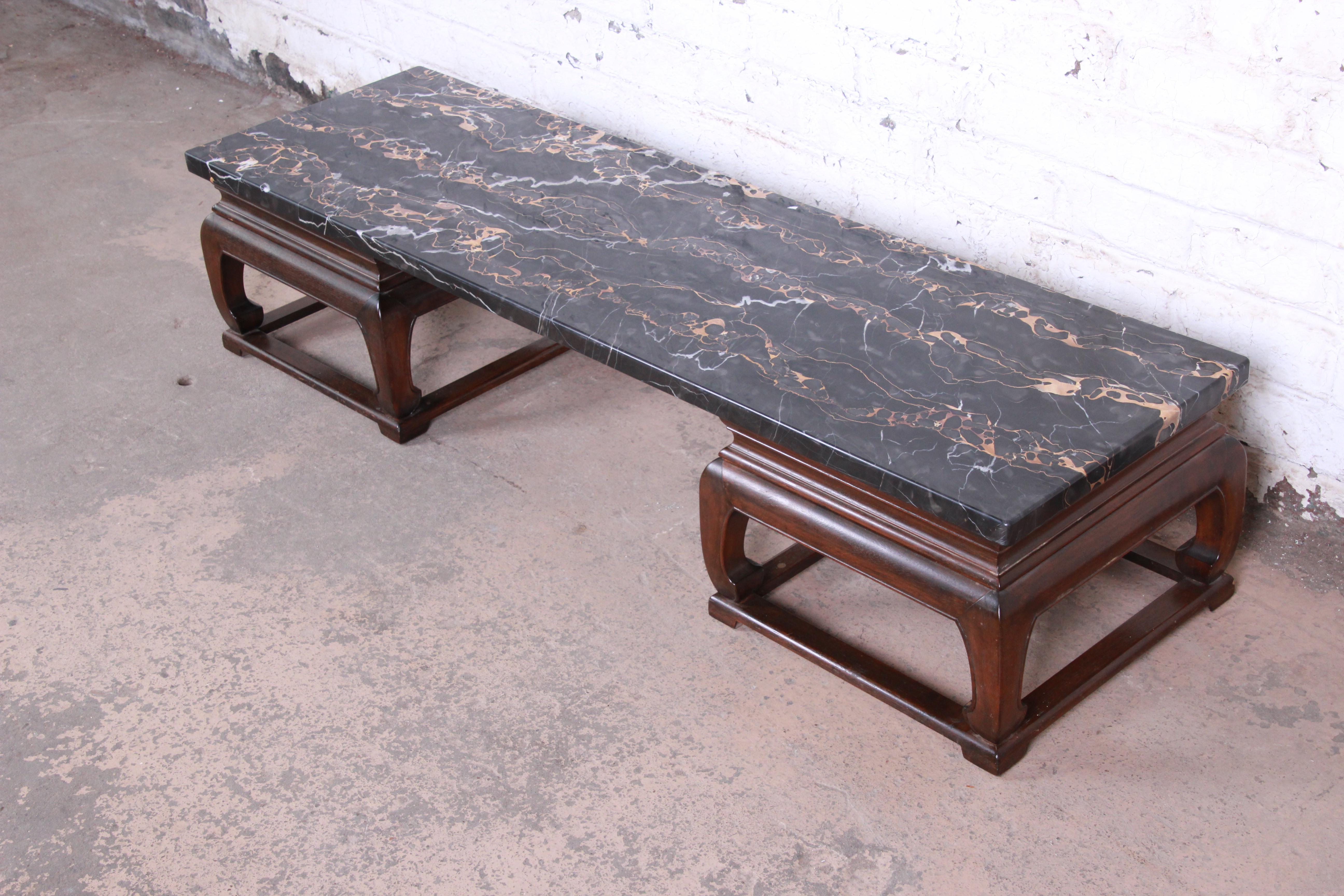 A rare and exceptional Mid-Century Modern chinoiserie marble top coffee table from the Far East collection by Michael Taylor for Baker Furniture. The table features a beautiful solid mahogany Asian-inspired double pedestal base and a truly stunning