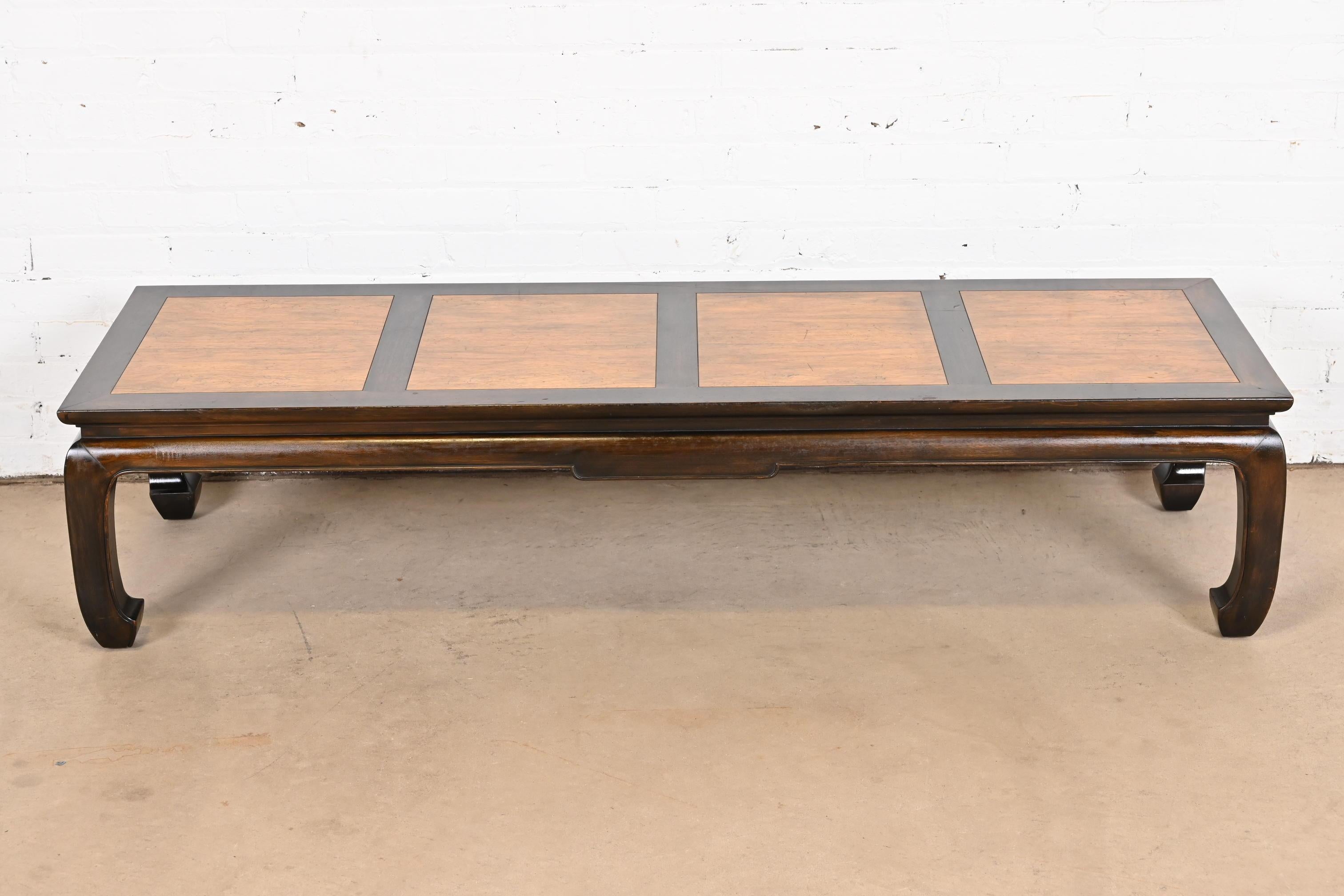 A gorgeous mid-century modern Hollywood Regency Chinoiserie sculpted walnut coffee table or cocktail table

By Michael Taylor for Baker Furniture, 