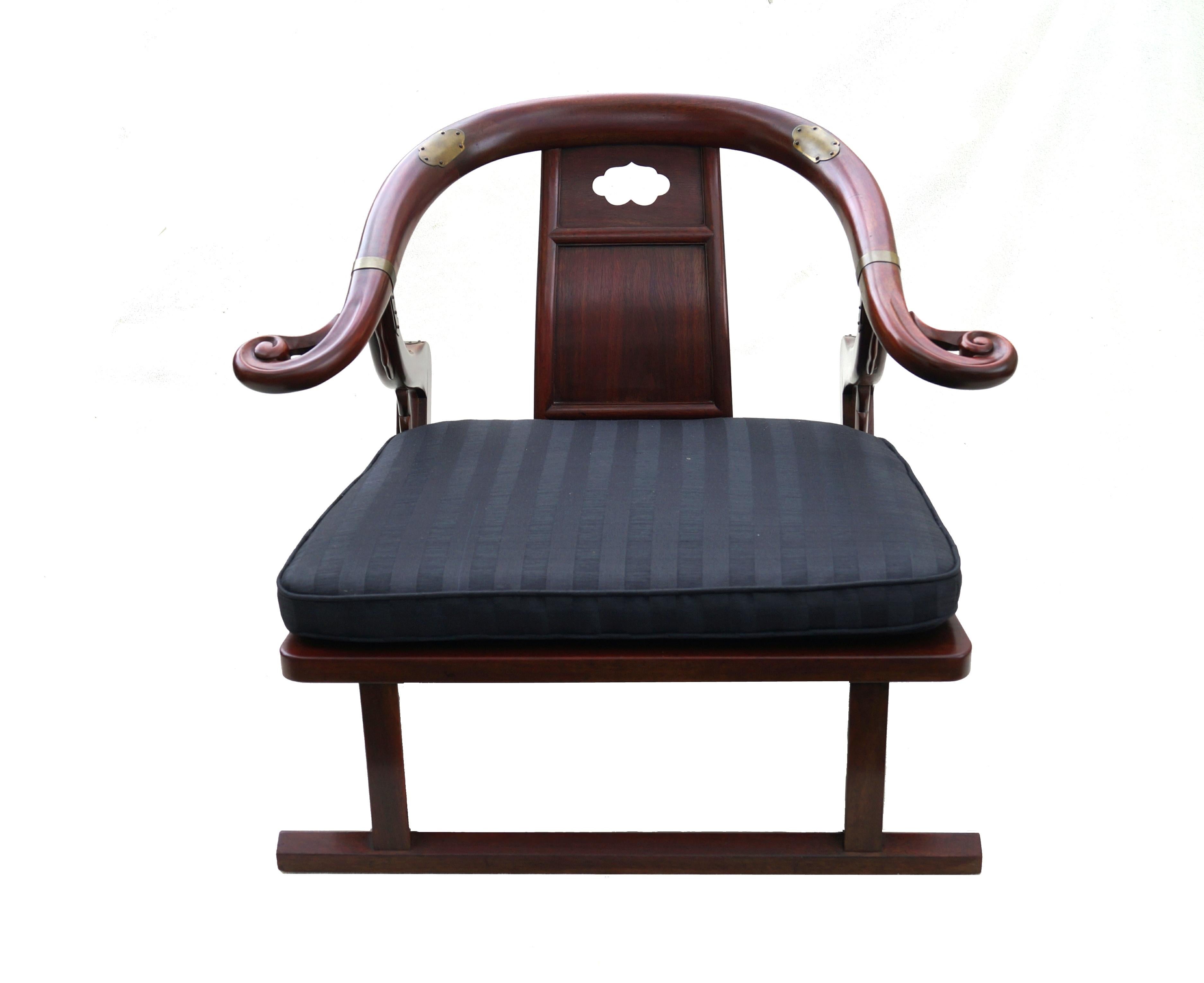 A fine Asian inspired, brass accented and lounge chair from the 