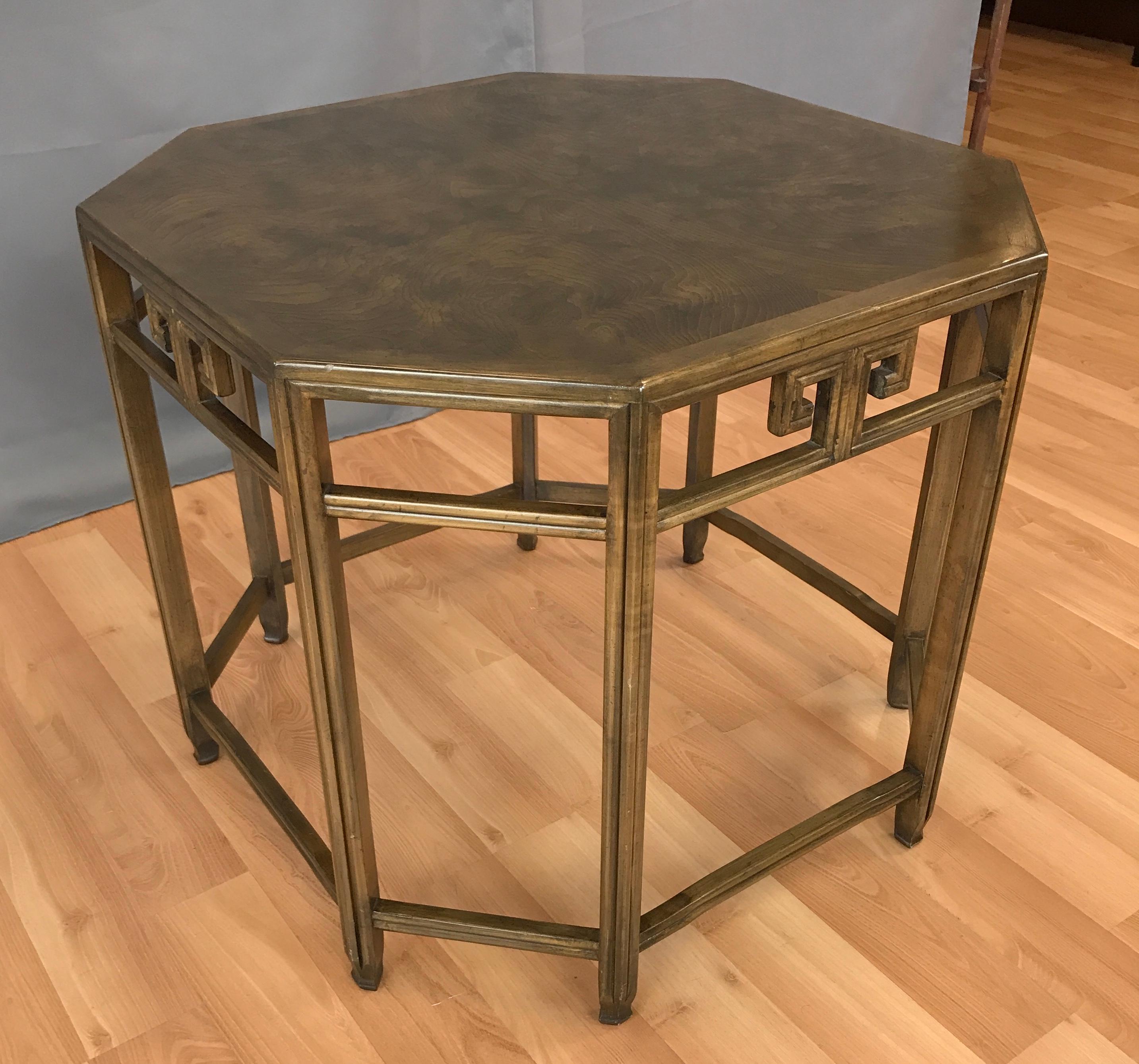 Offered is a Michael Taylor design for Baker, an octagonal end table for his Far East collection.
Burl wood walnut top, with Greek key detailing to its sides, open design so visually it doesn't take up a lot of room.