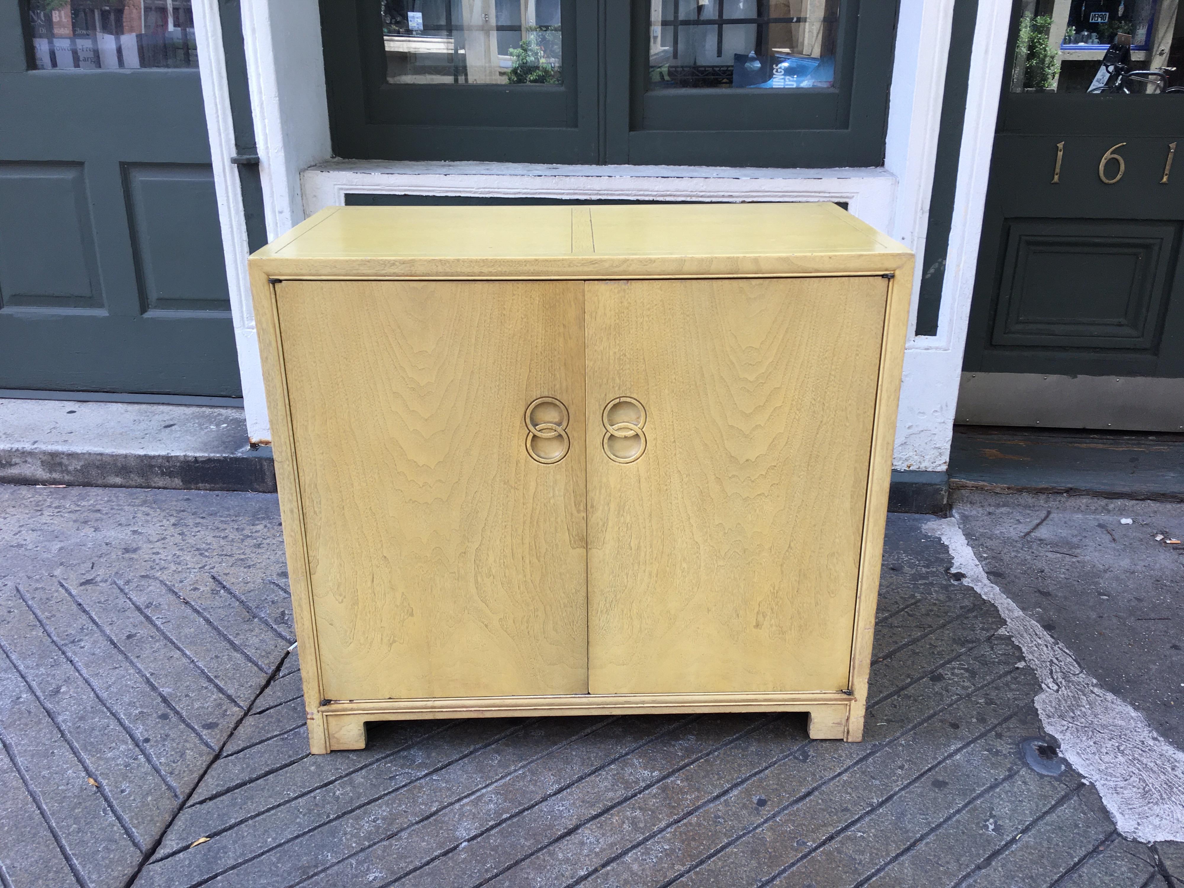 Michael Taylor for Baker Furniture cabinet in original ivory finish. 2 doors open to reveal 6 pull out drawers. Cabinet is in great solid condition! Ready to use or refinish as you want! Perfect in the bedroom or dining room!