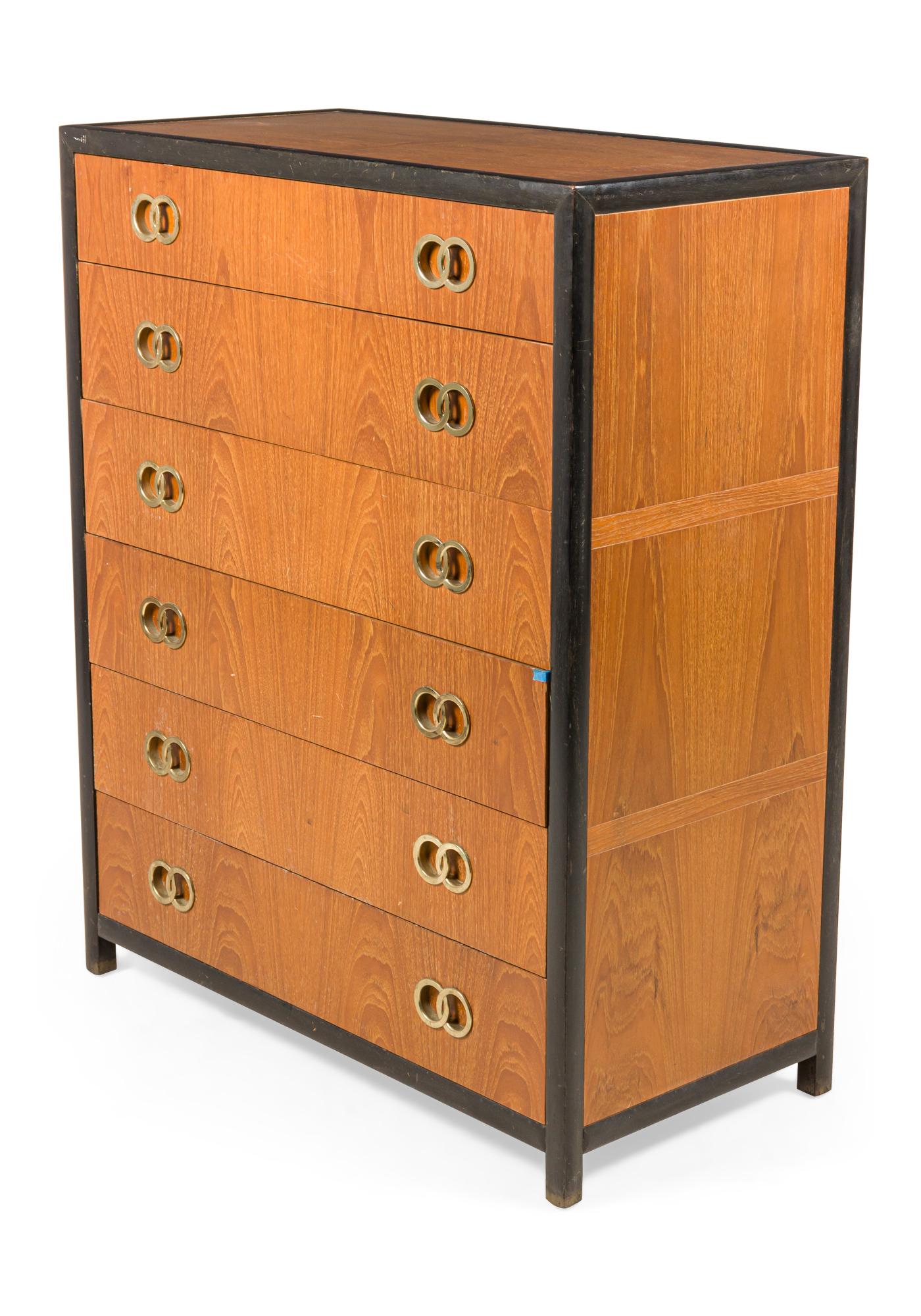American Mid-Century 6-drawer high chest with a dark stained frame and walnut drawer fronts and body with brass interlocking ring inset drawer pulls. (MICHAEL TAYLOR FOR BAKER FURNITURE CO).
 