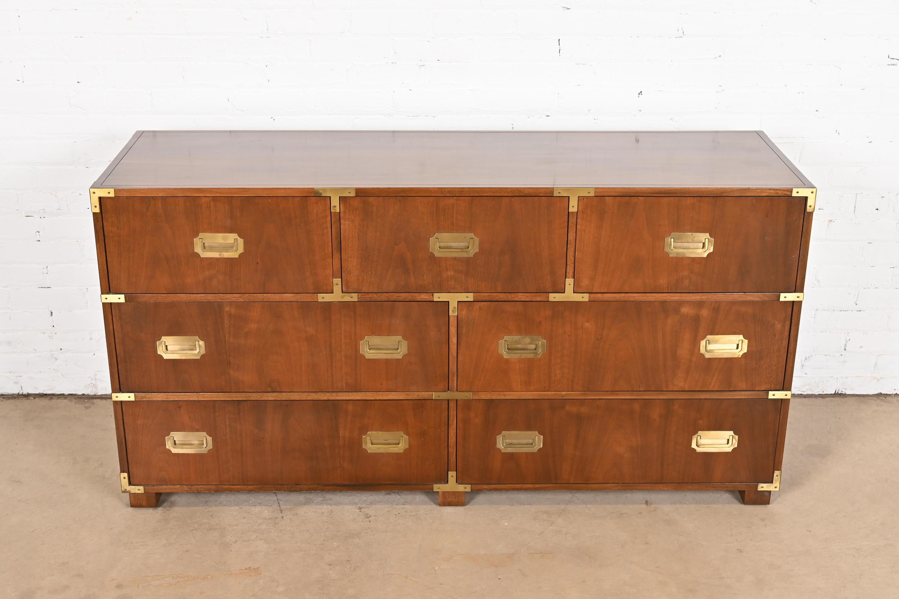 A stunning mid-century modern Hollywood Regency Campaign style seven-drawer dresser or chest of drawers

By Michael Taylor for Baker Furniture, 