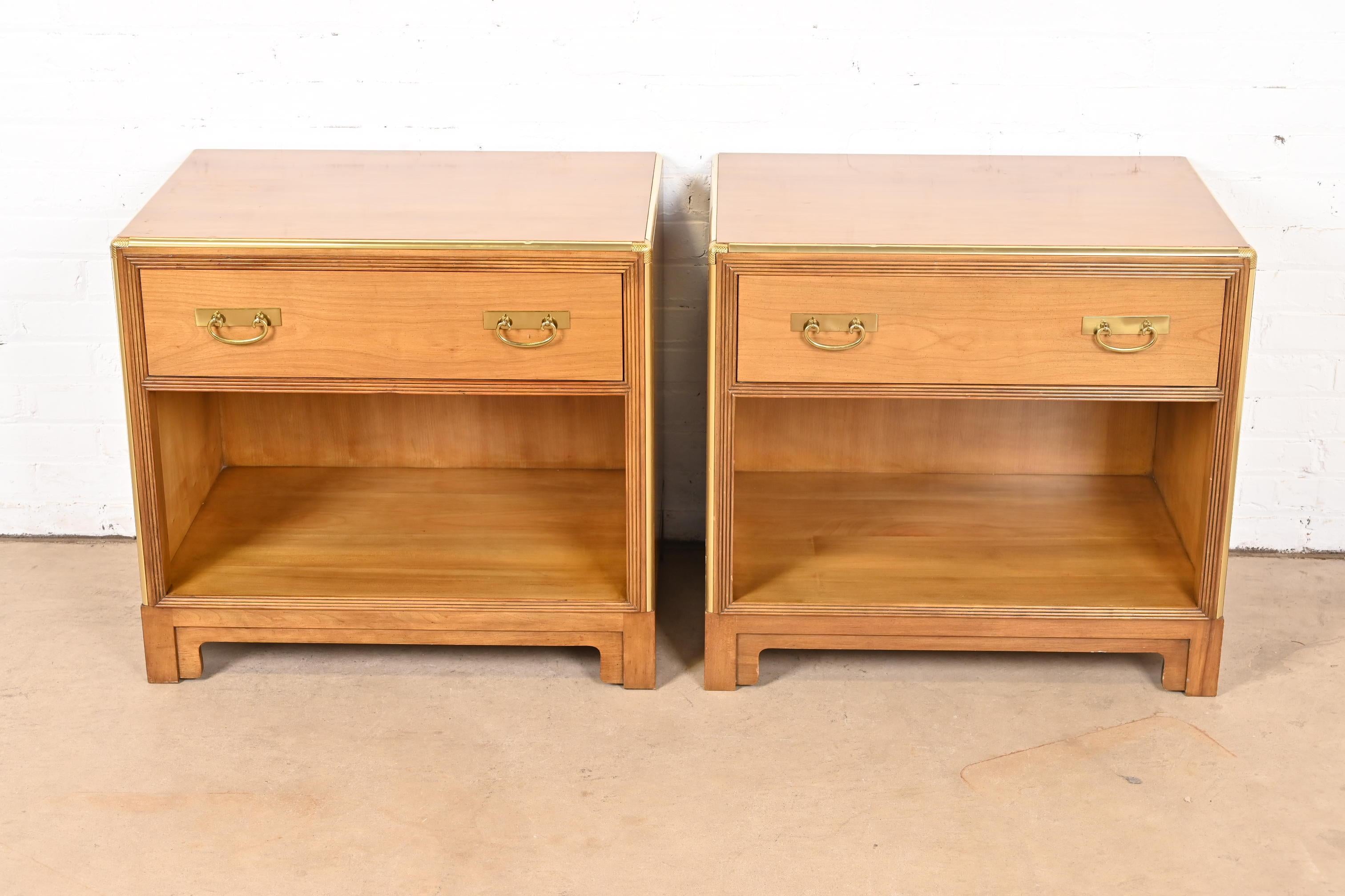 A beautiful pair of mid-century modern Hollywood Regency nightstands

By Michael Taylor for Baker Furniture

USA, Circa 1960s

Cherry wood, with original Asian-inspired brass hardware and brass trim.

Each measures: 28