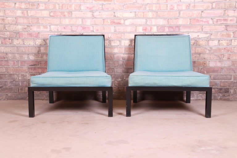An exceptional pair of Mid-Century Modern Hollywood Regency slipper chairs, club chairs, or lounge chairs

By Michael Taylor for Baker Furniture, 