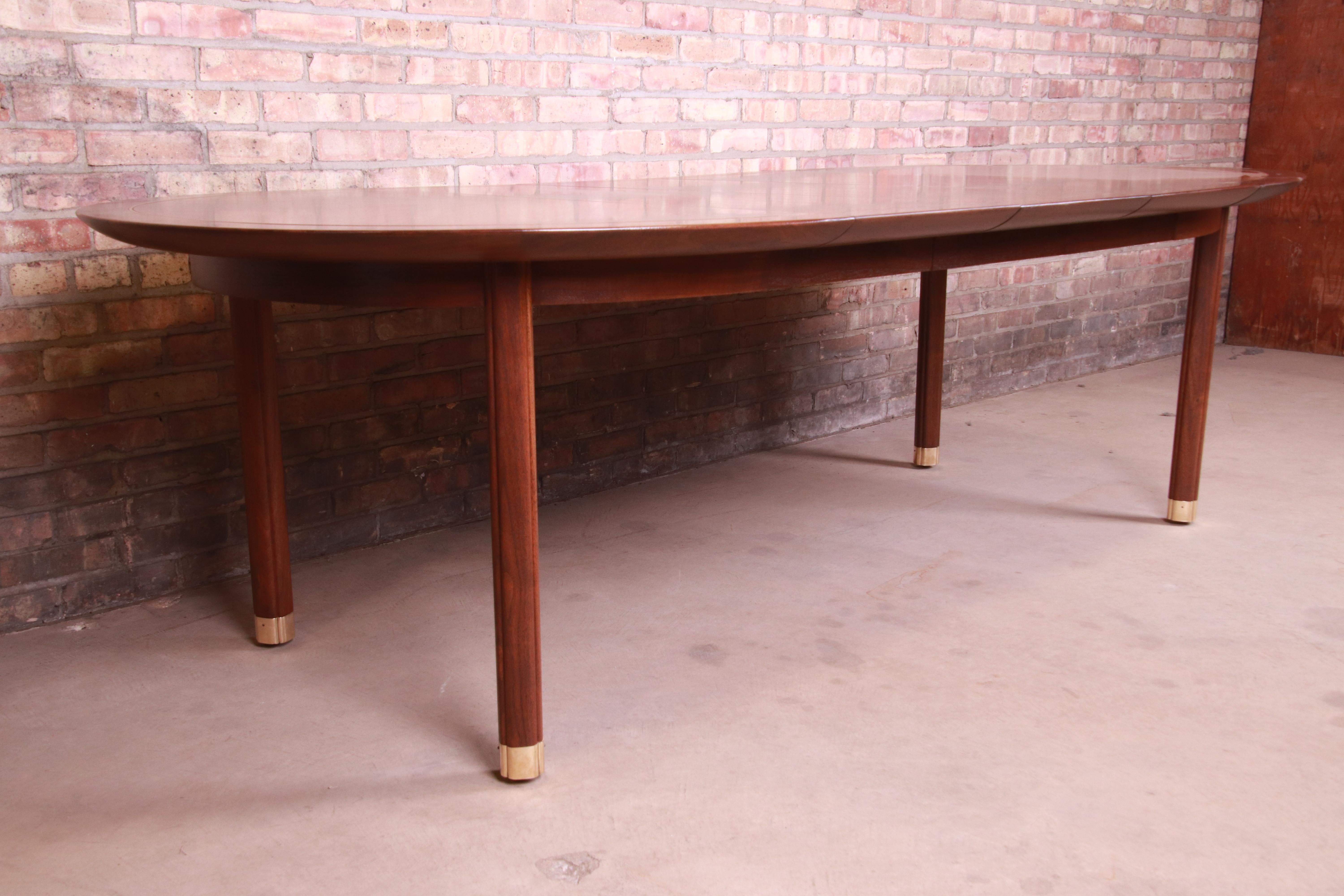 Michael Taylor for Baker Furniture Walnut and Brass Inlay Extension Dining Table In Good Condition In South Bend, IN