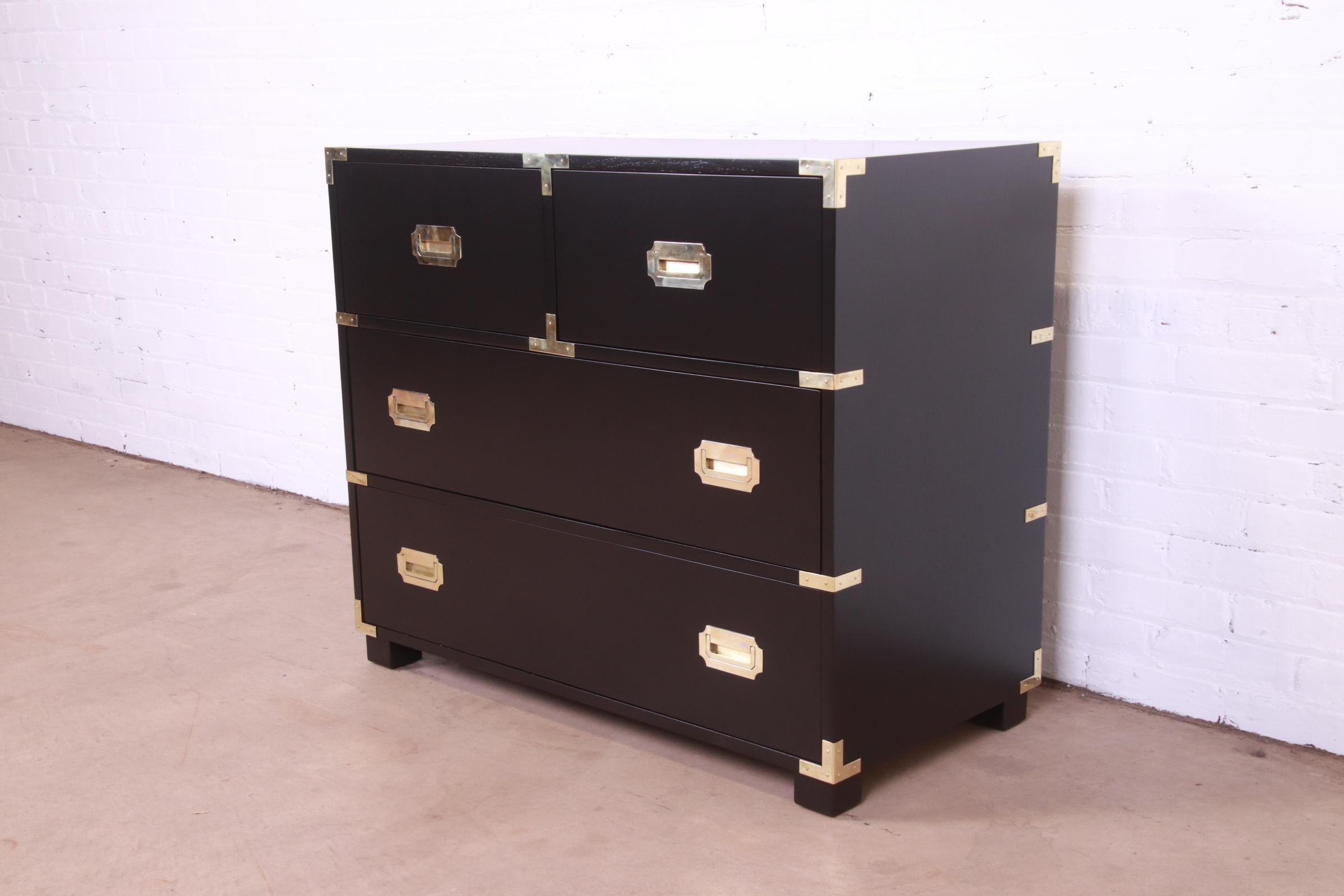 An exceptional Mid-Century Modern Hollywood Regency Campaign style four-drawer dresser or chest of drawers

By Michael Taylor for Baker Furniture, 