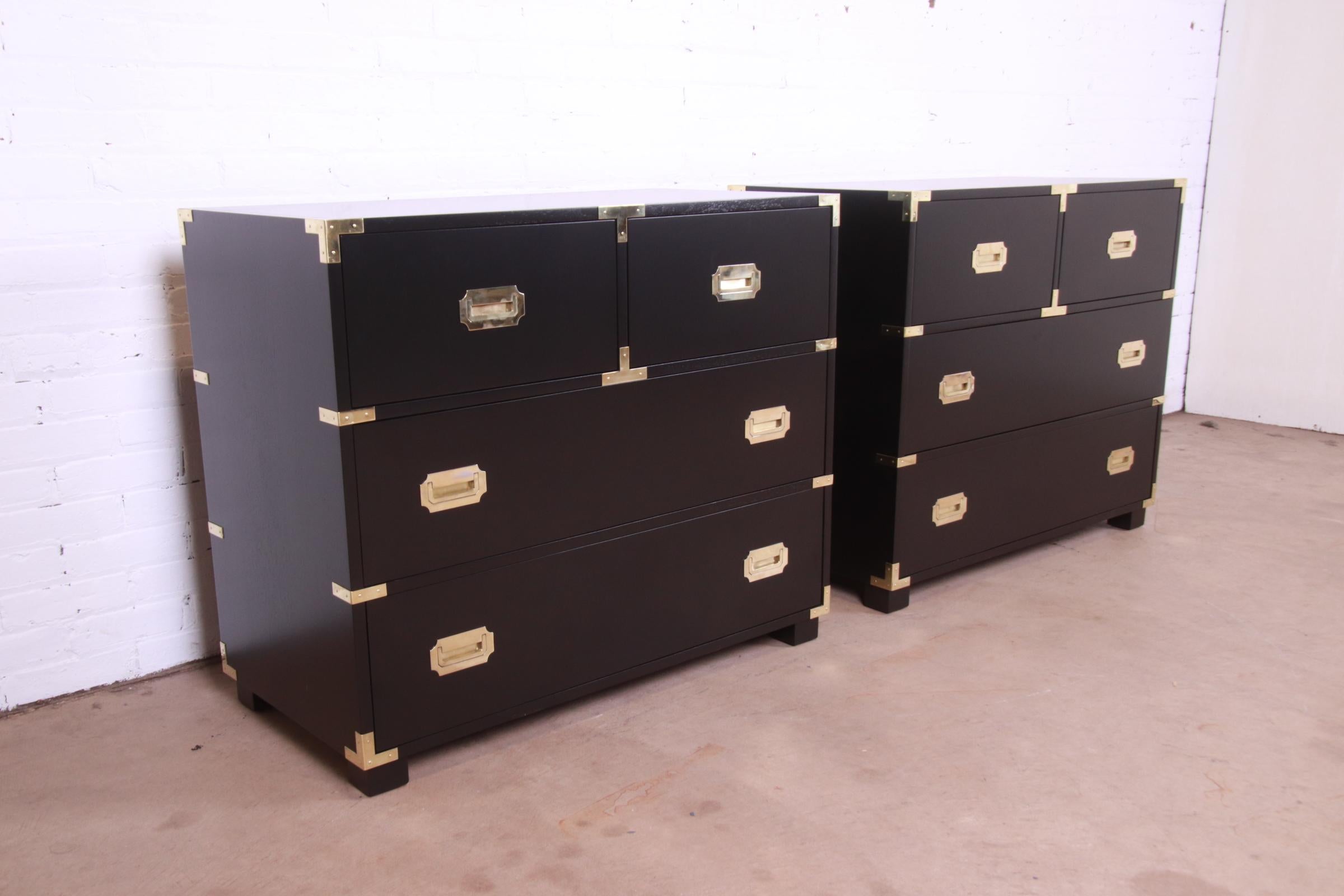 An exceptional pair of mid-century modern Hollywood Regency Campaign style four-drawer dressers or chest of drawers

By Michael Taylor for Baker Furniture, 