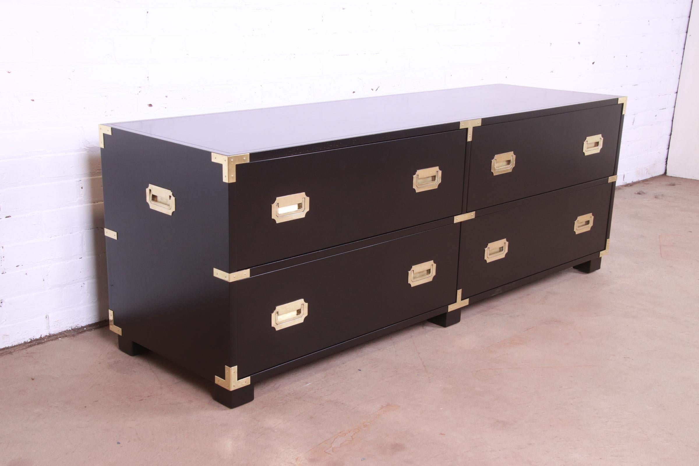 An exceptional Mid-Century Modern Hollywood Regency Campaign style four-drawer lowboy dresser or chest of drawers

By Michael Taylor for Baker Furniture, 