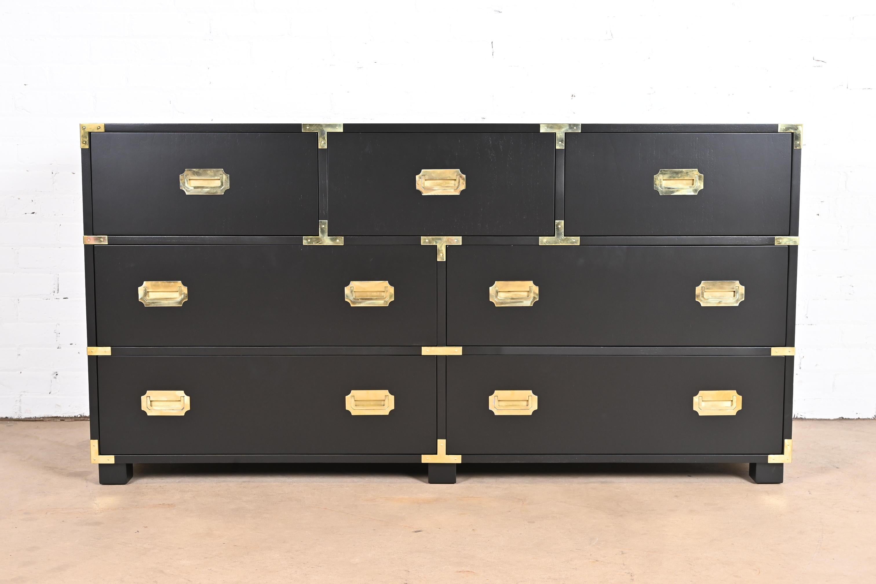 An exceptional mid-century modern Hollywood Regency Campaign style seven-drawer dresser or credenza

By Michael Taylor for Baker Furniture, 