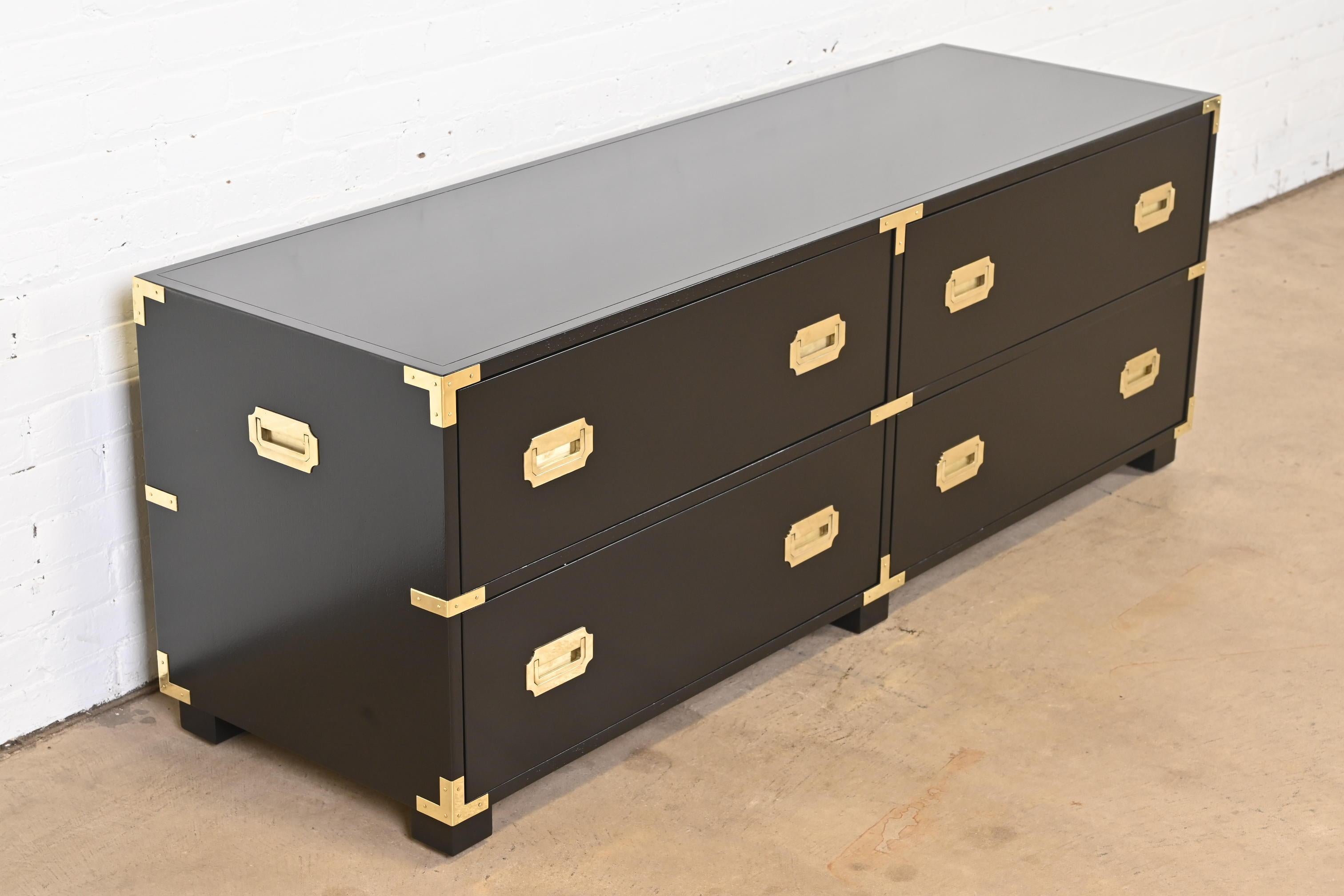 An exceptional Mid-Century Modern Hollywood Regency Campaign four-drawer low dresser or chest of drawers

By Michael Taylor for Baker Furniture, 