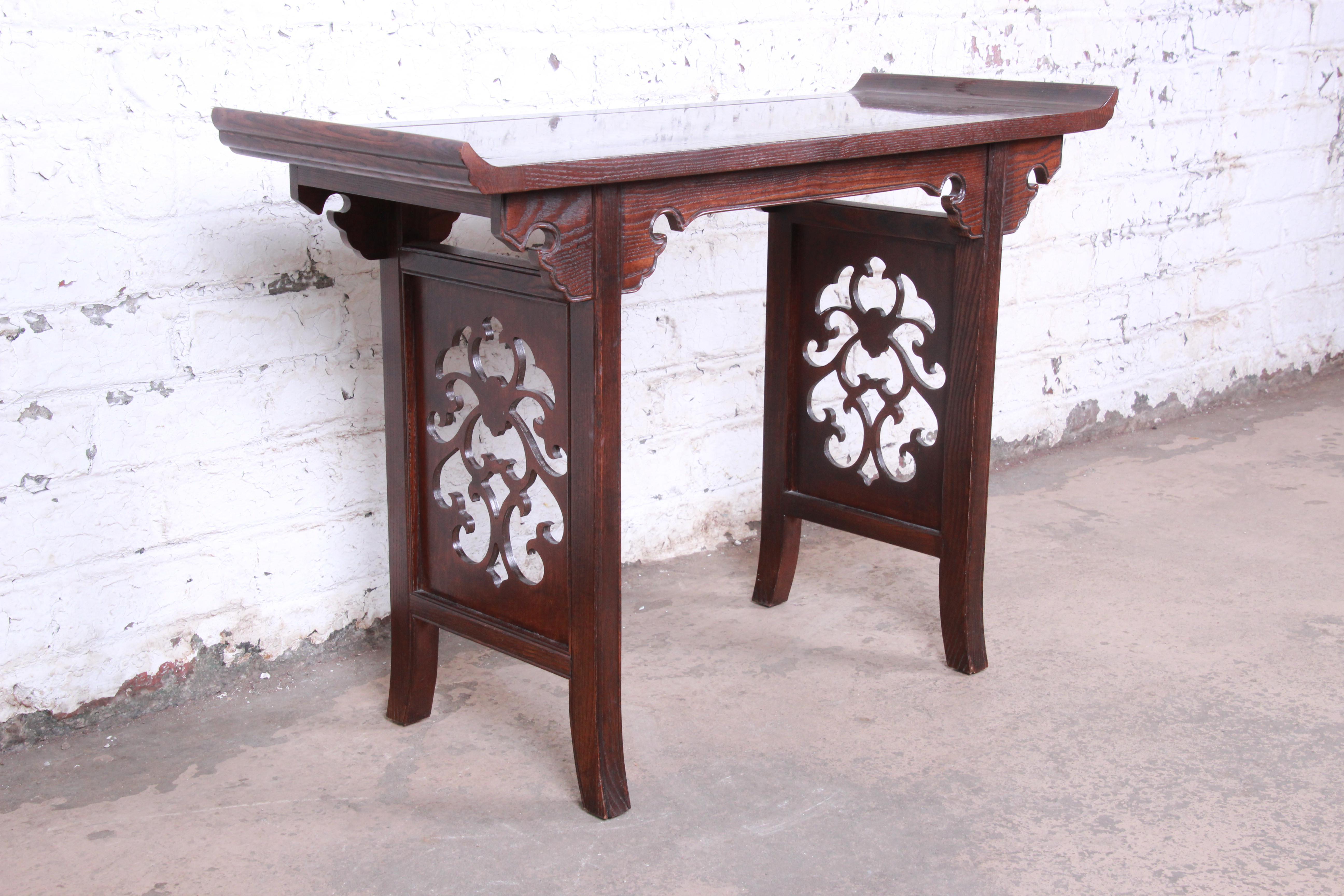 Mid-Century Modern chinoiserie console or altar table

Designed by Michael Taylor for Baker Furniture

USA, circa 1960s

Carved walnut + burl

Measures: 40.25