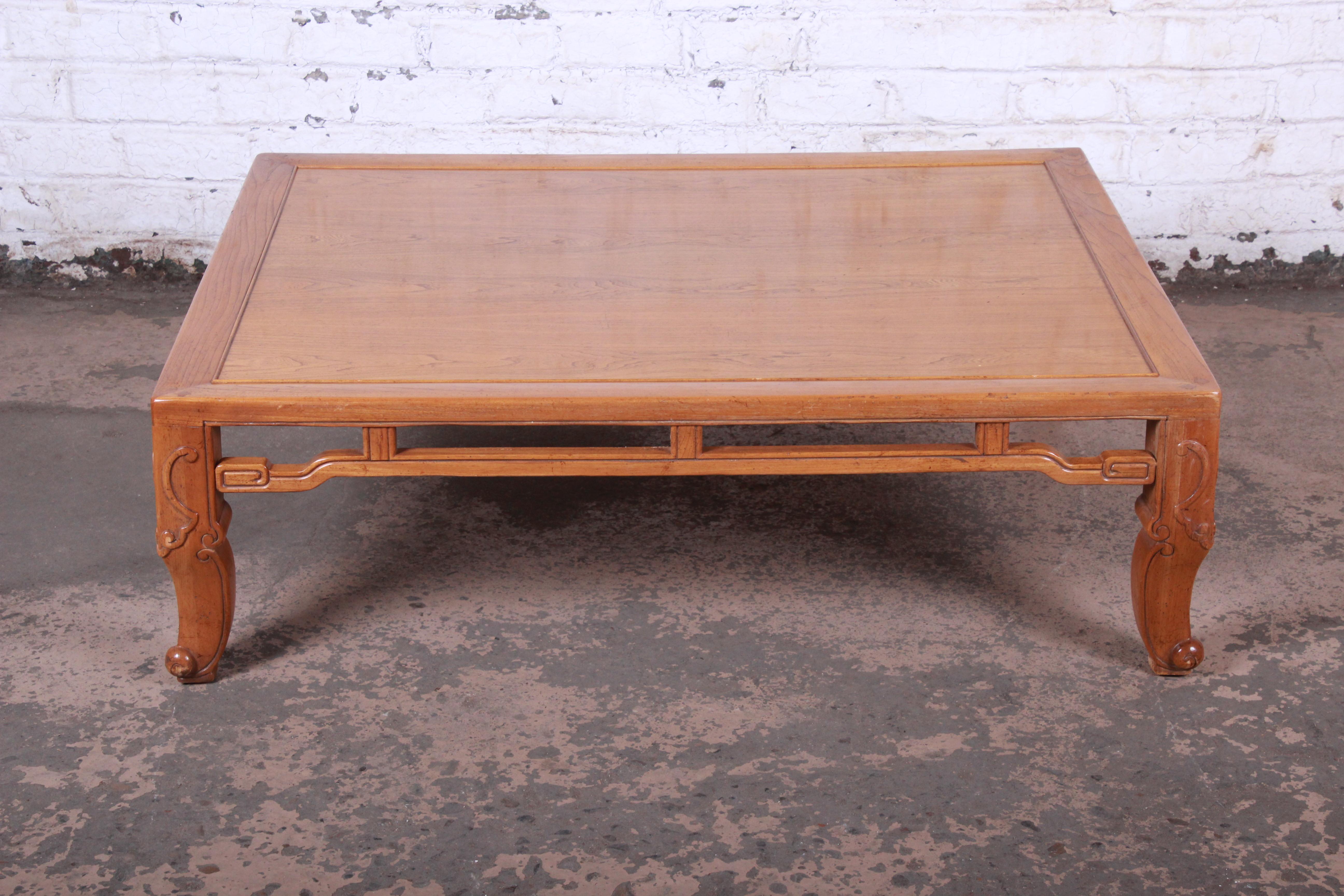 Mid-Century Modern Hollywood Regency chinoiserie large coffee or cocktail table

Designed by Michael Taylor for Baker Furniture

USA, circa 1970s

Elm wood with carved Asian details

Measures: 50