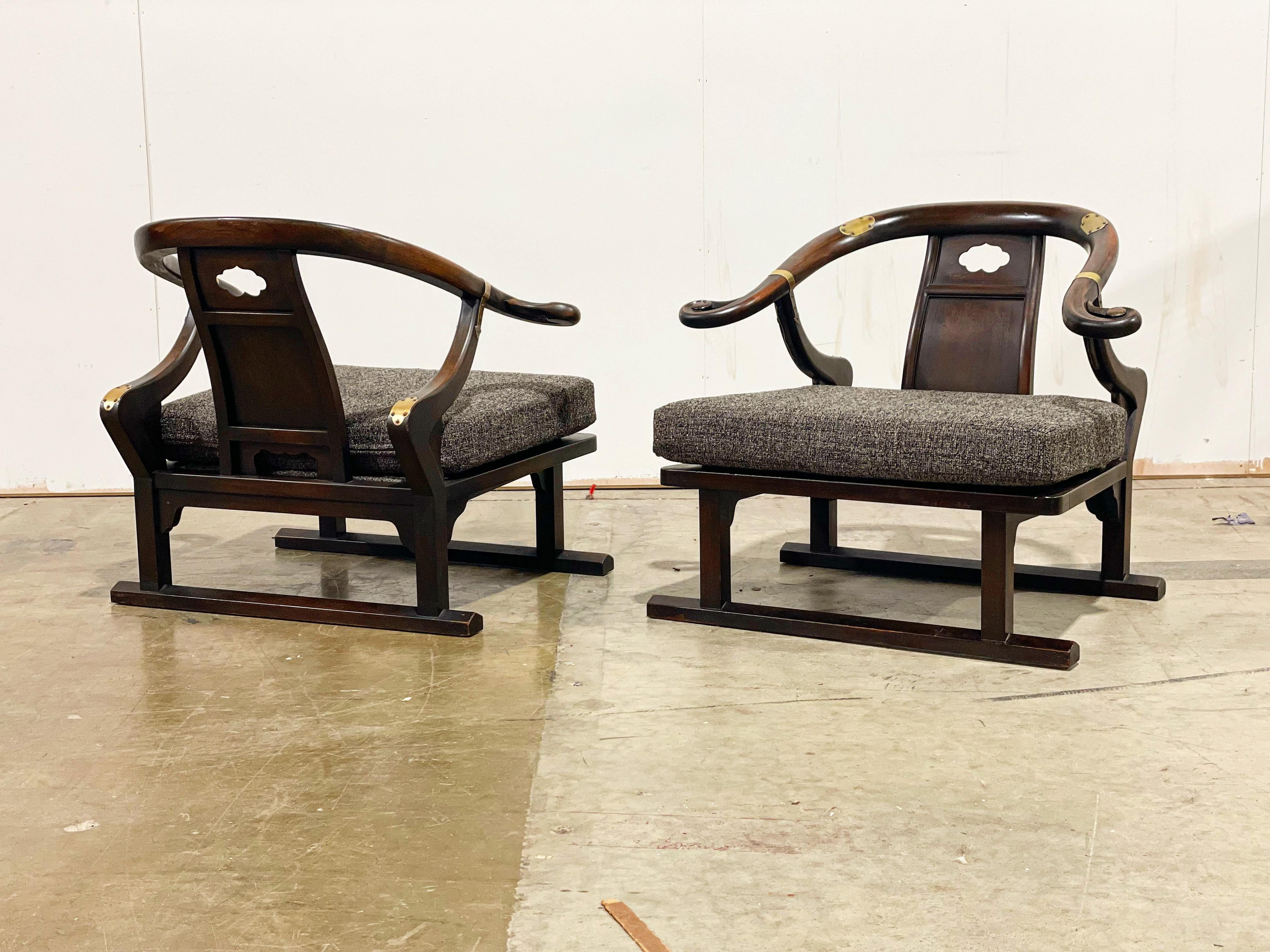 Michael Taylor for Baker - Far East Collection - Model 2510 - circa 1948
Exquisite pair of sculpted solid walnut and brass lounge chairs. Horseshoe or wishbone back with sled base. Stout and sturdy American craftsmanship.
This pair is in excellent