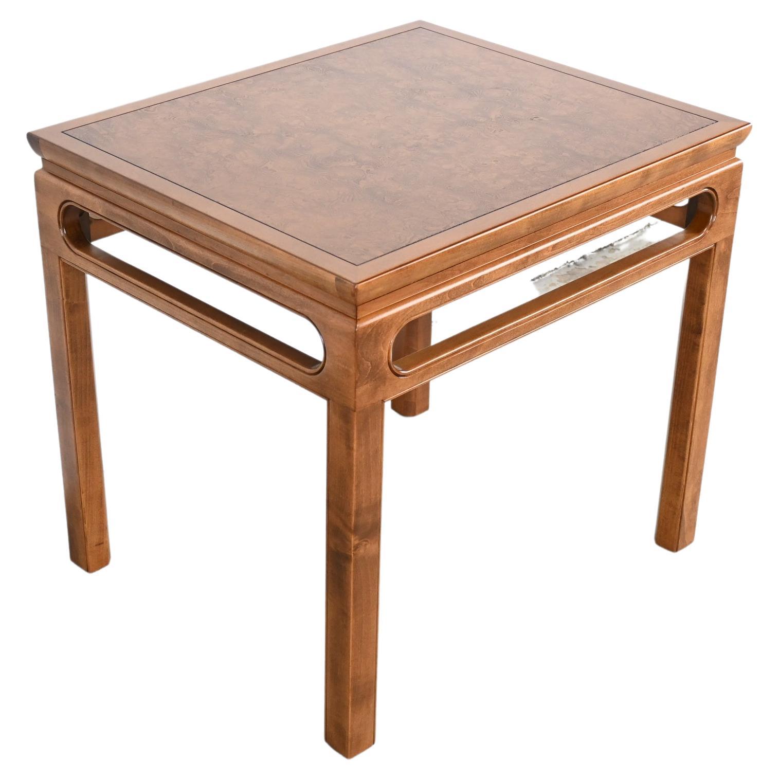 Michael Taylor for Baker Furniture mid-century Chinoiserie inspired rectangular end table

Baker Furniture, USA, 1960s

Measures: 26 wide x 22 deep x 24.25 high

Mid-century Asian inspired rectangular end table with burl wood top. Matching