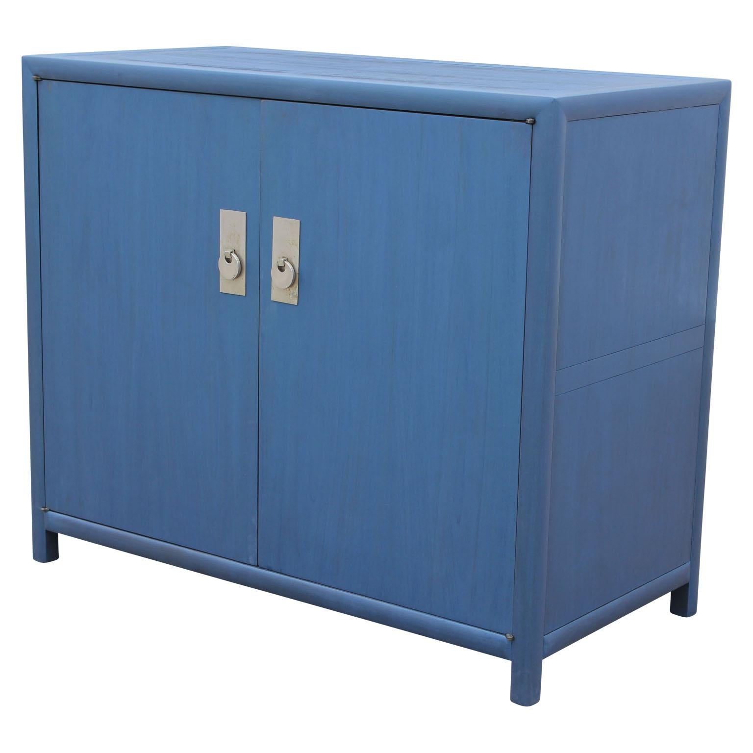 Beautiful cabinet by Michael Taylor for Baker's New World collection. It is in a striking blue. 

This listing is just for the cabinet.